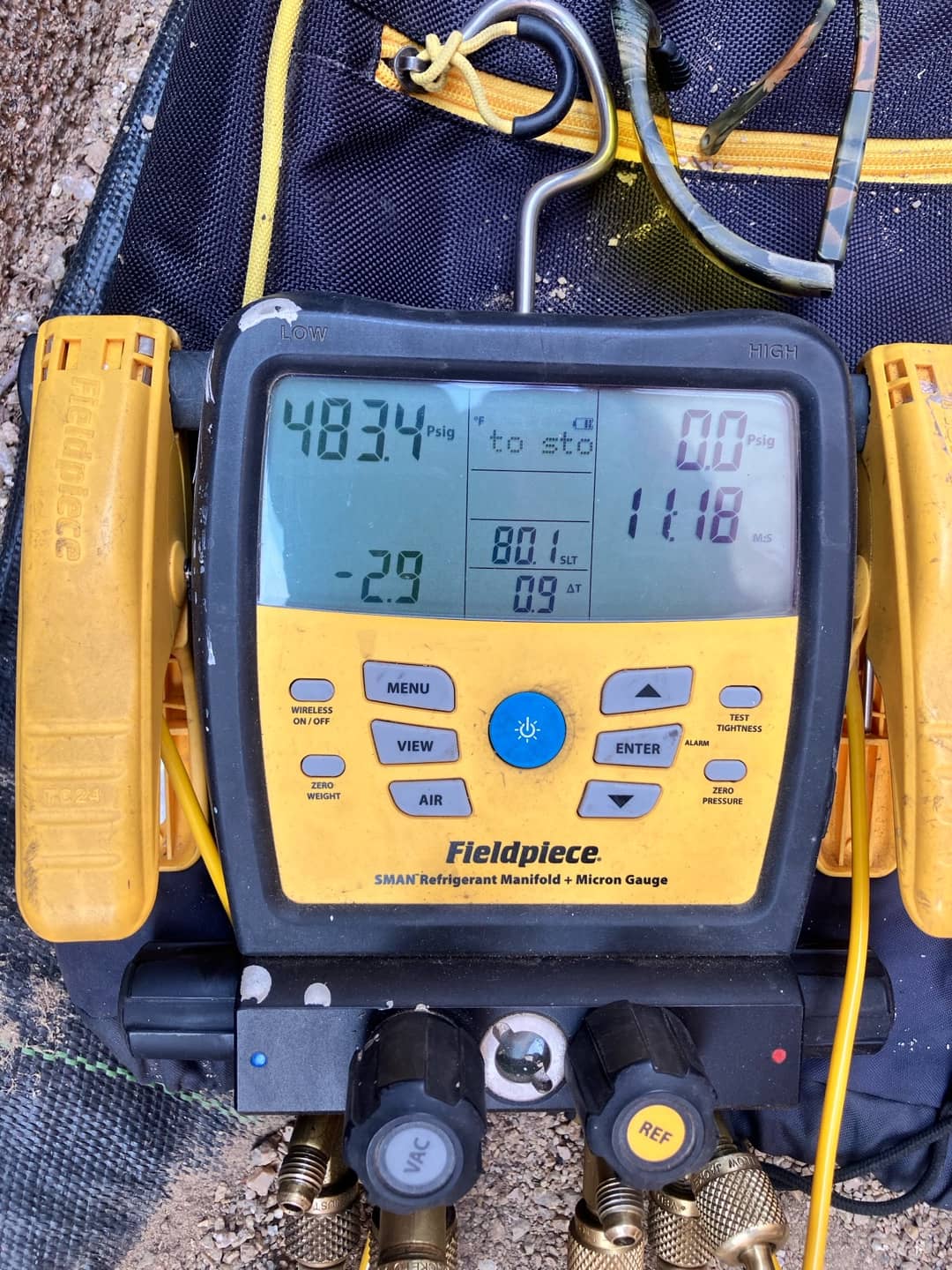 Digital manifold shows both high and low sides stabilized at 483 PSI during a nitrogen pressure test on the new system.