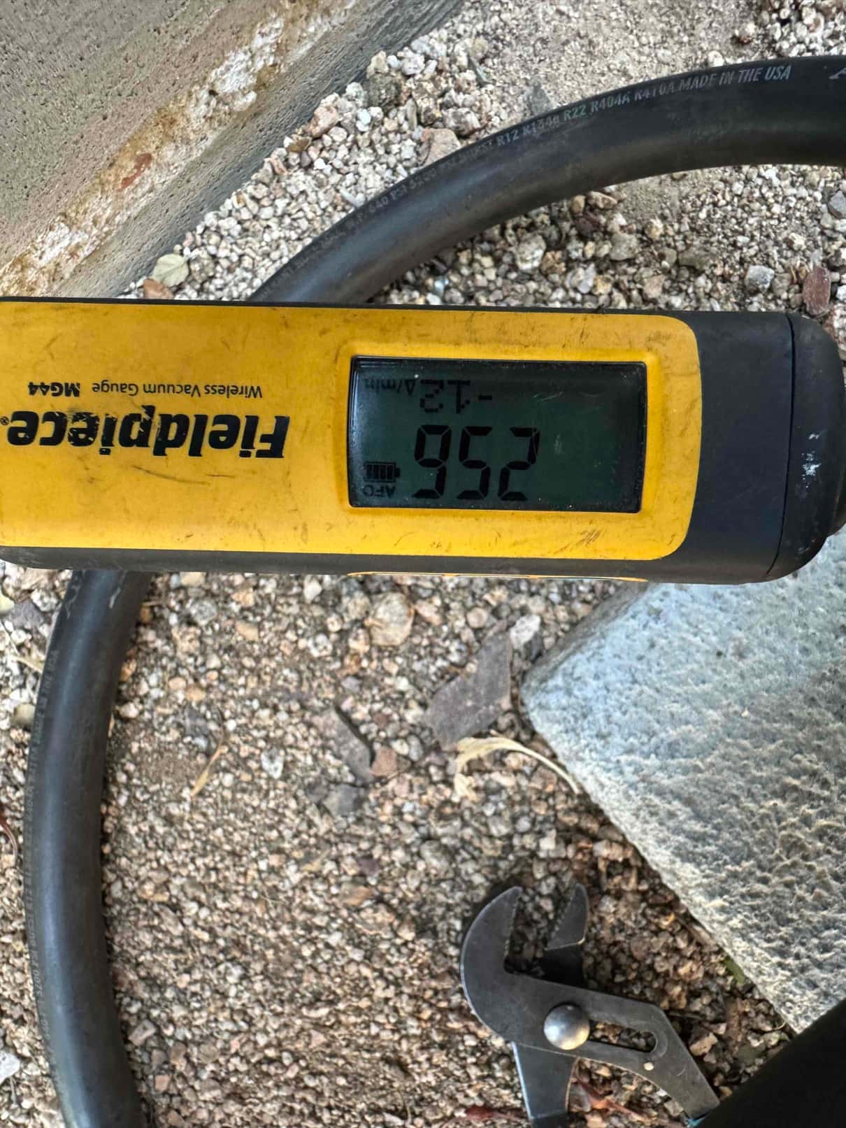 Micron gauge connected during system evacuation shows 952 microns while pulling vacuum on the new installation.