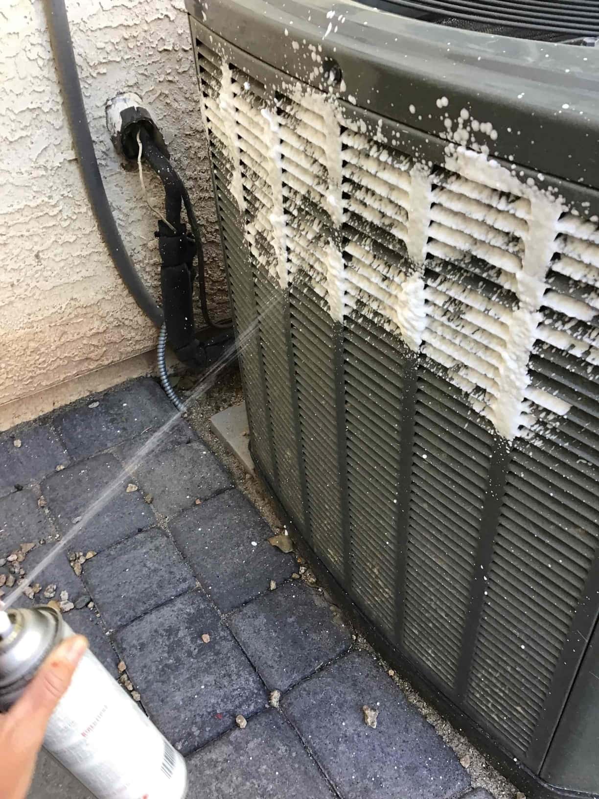Aerosol foaming cleaner applied to the outdoor condenser coil fins.