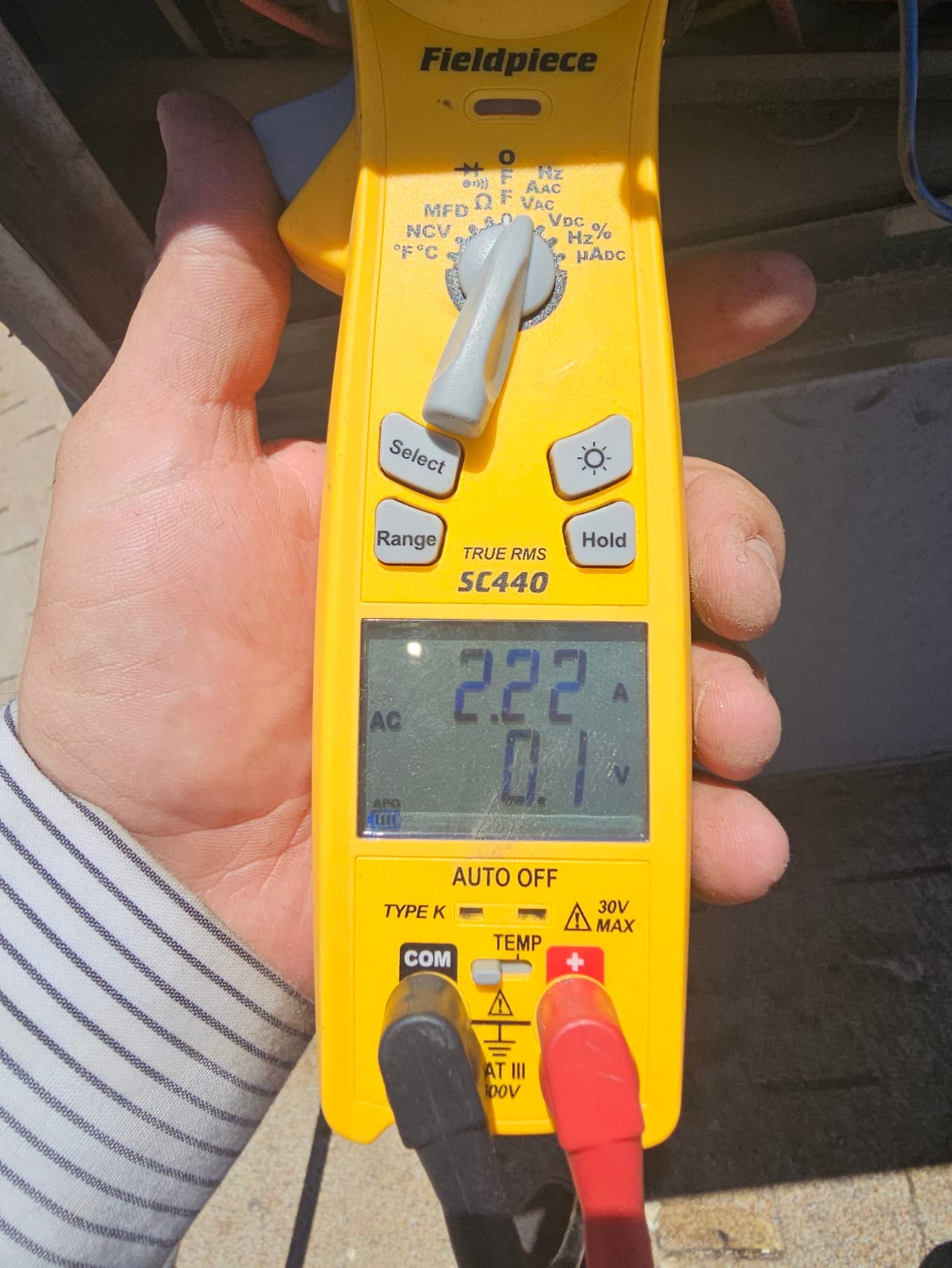 HVAC diagnostic instrument photographed during the service visit.