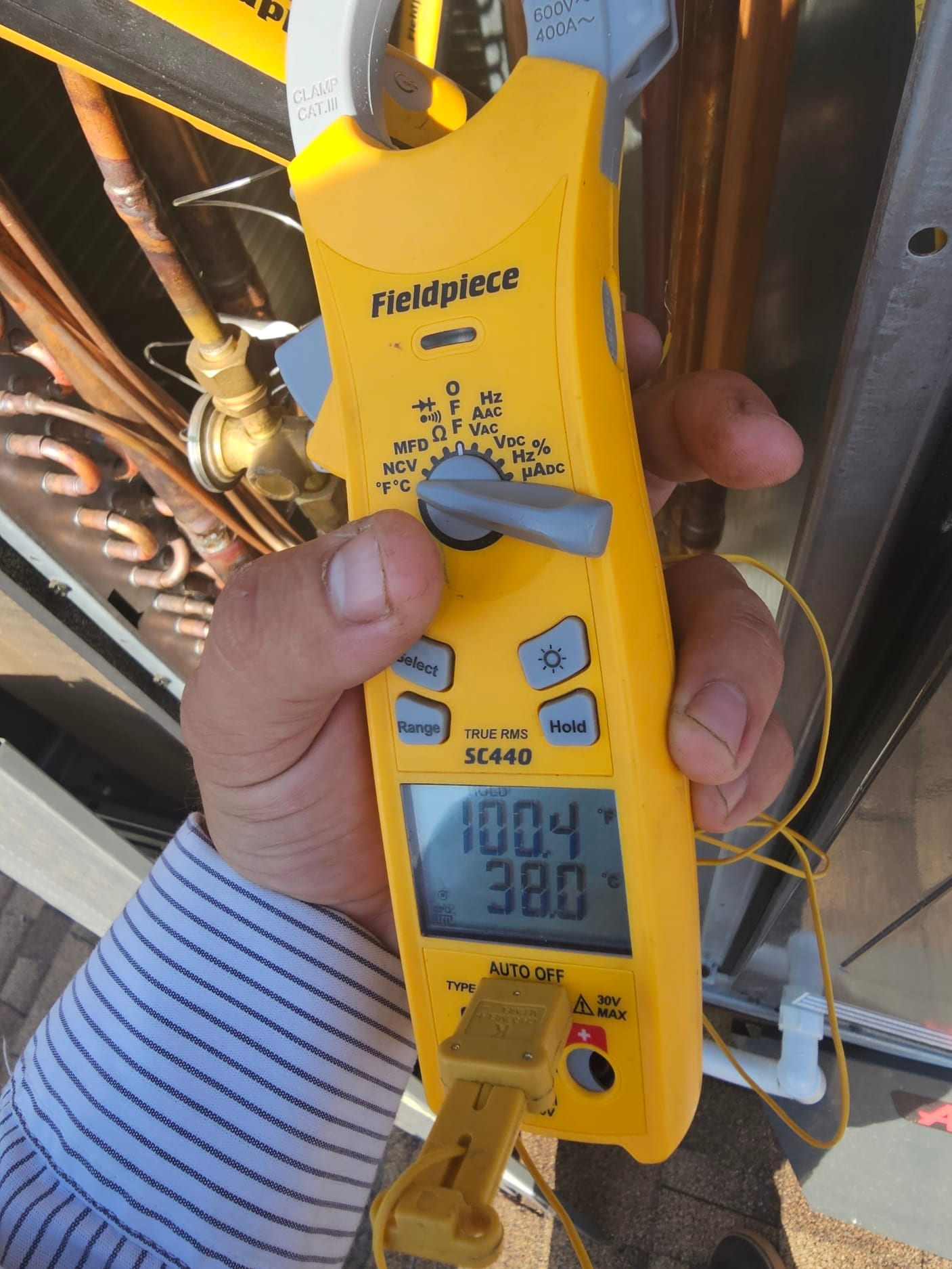Diagnostic instrument display shows 100.4 °F.