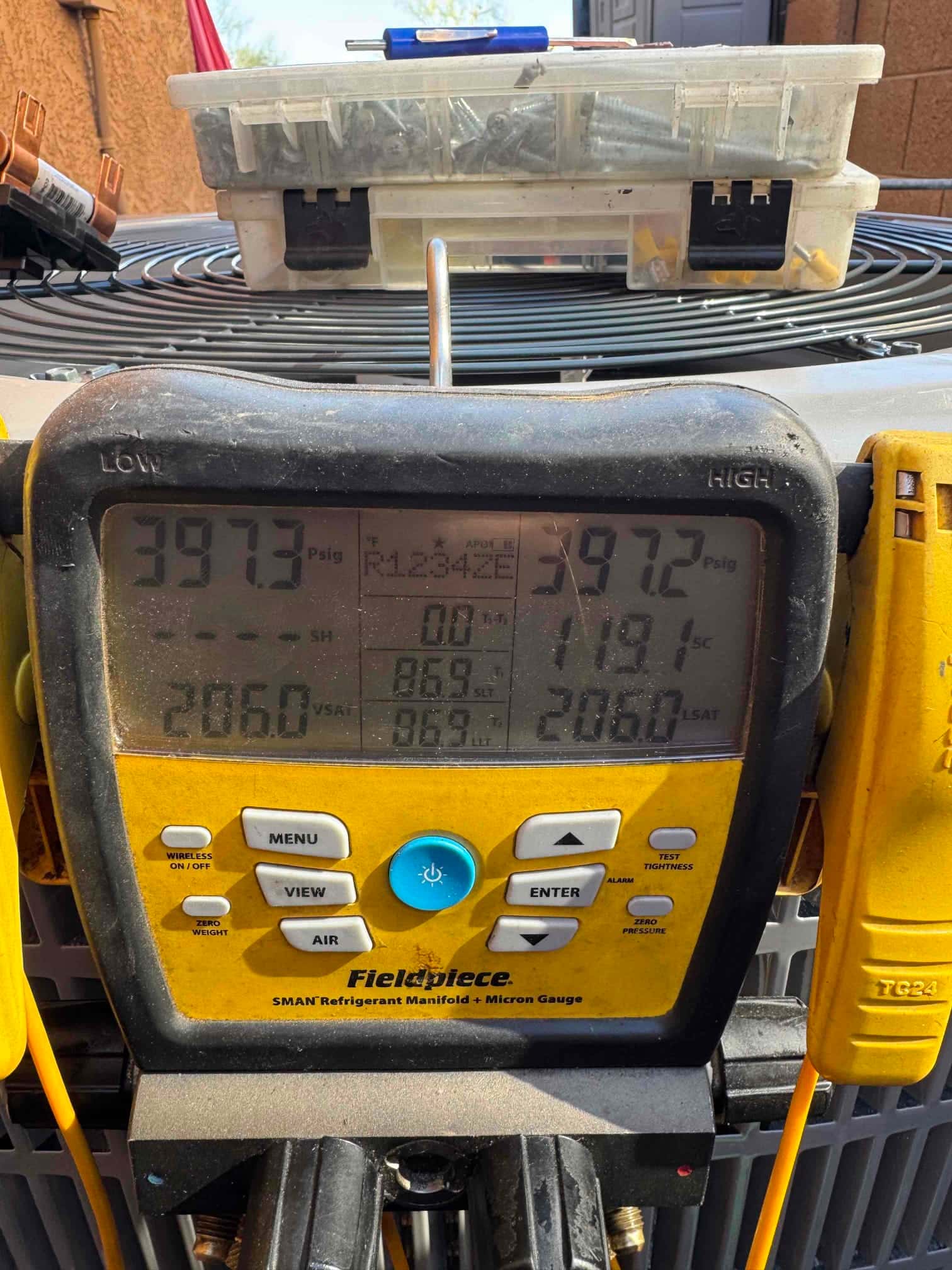 Digital manifold shows both high and low sides at approximately 397 PSI, documenting a nitrogen pressure test on the new system.