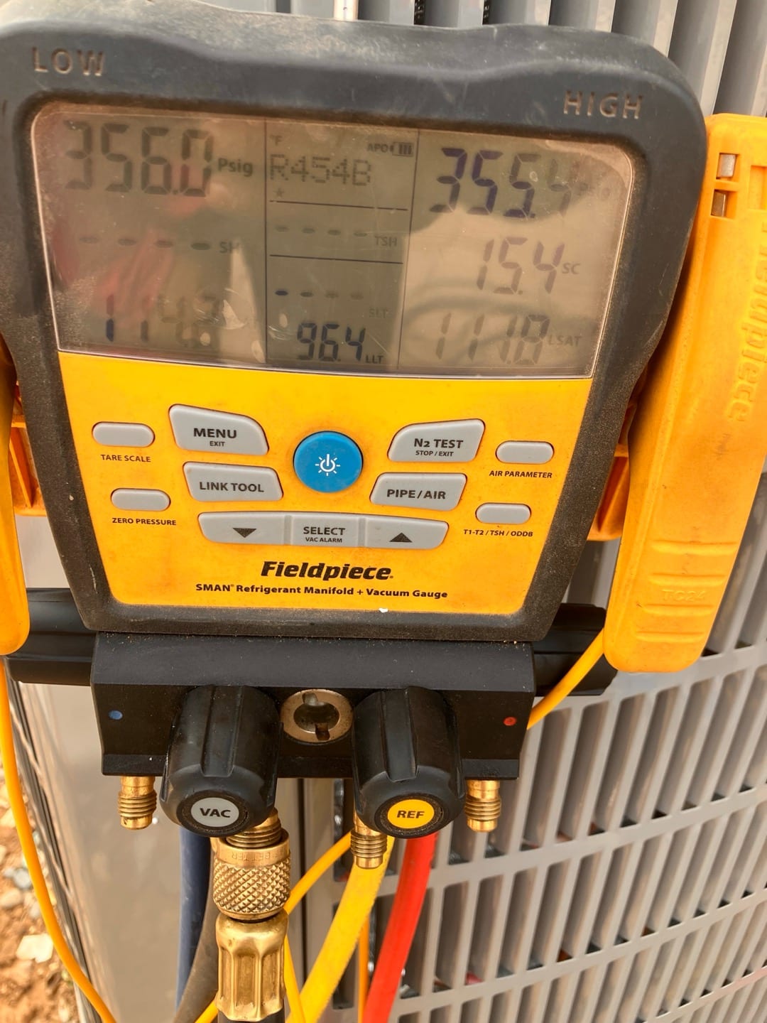 Digital manifold shows both high and low sides holding around 356 PSI during a nitrogen pressure test on the new system.
