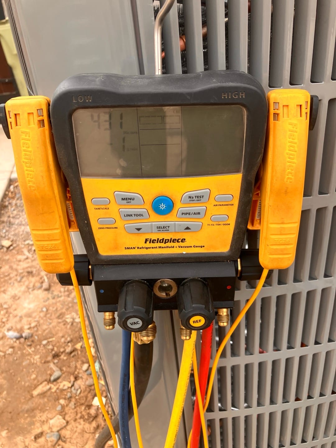 Digital manifold shows both low and high sides equalized at 431 PSI, documenting a nitrogen pressure test on the new system.