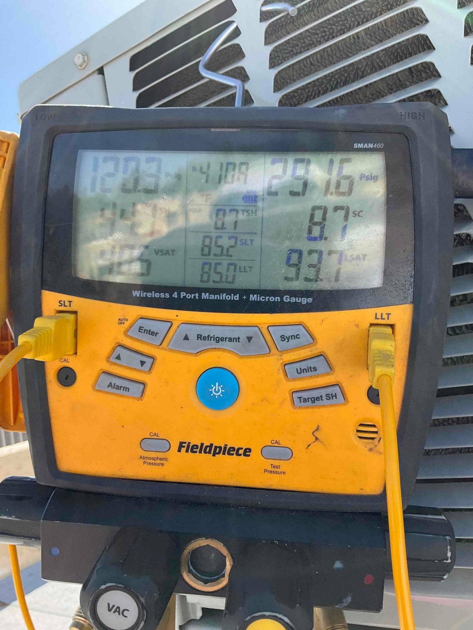 HVAC diagnostic instrument photographed during the service visit.