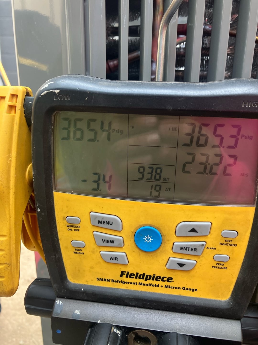 Digital manifold shows equal high-side and low-side pressures around 365 PSI, documenting a nitrogen pressure test on the new system.