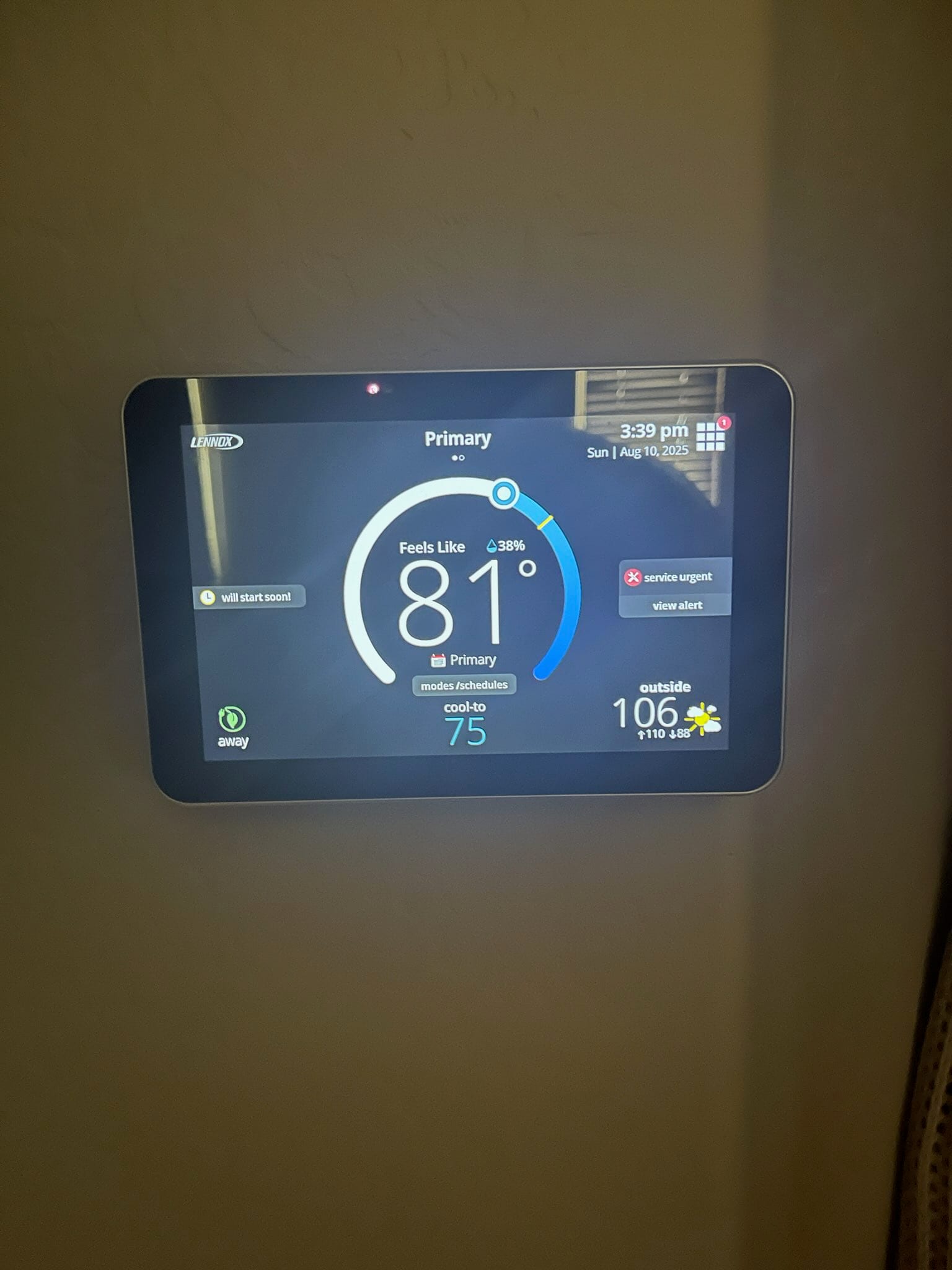 Smart thermostat display shows indoor temperature at 81°F with cooling setpoint at 75°F and outdoor temperature at 106°F.