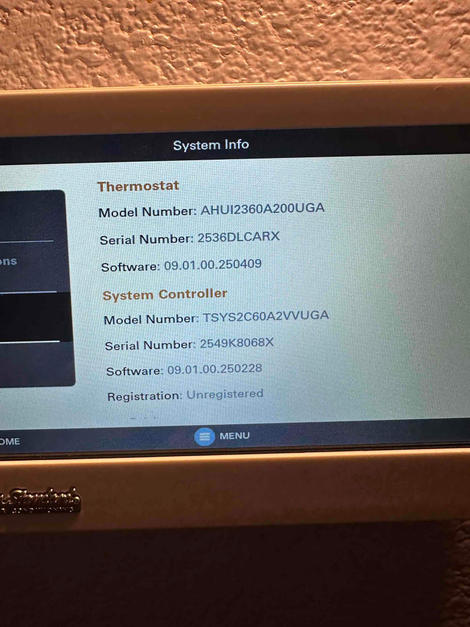 Thermostat touchscreen displays system information for thermostat and system controller during setup after installation.