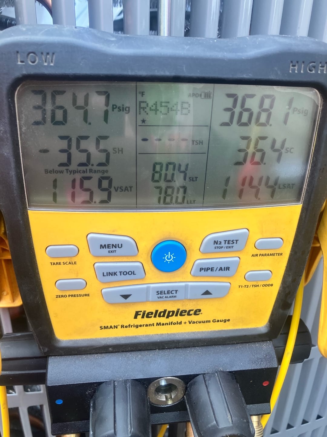 Digital manifold gauges display equal high pressures around 365 to 368 PSI on both sides during a nitrogen pressure test.