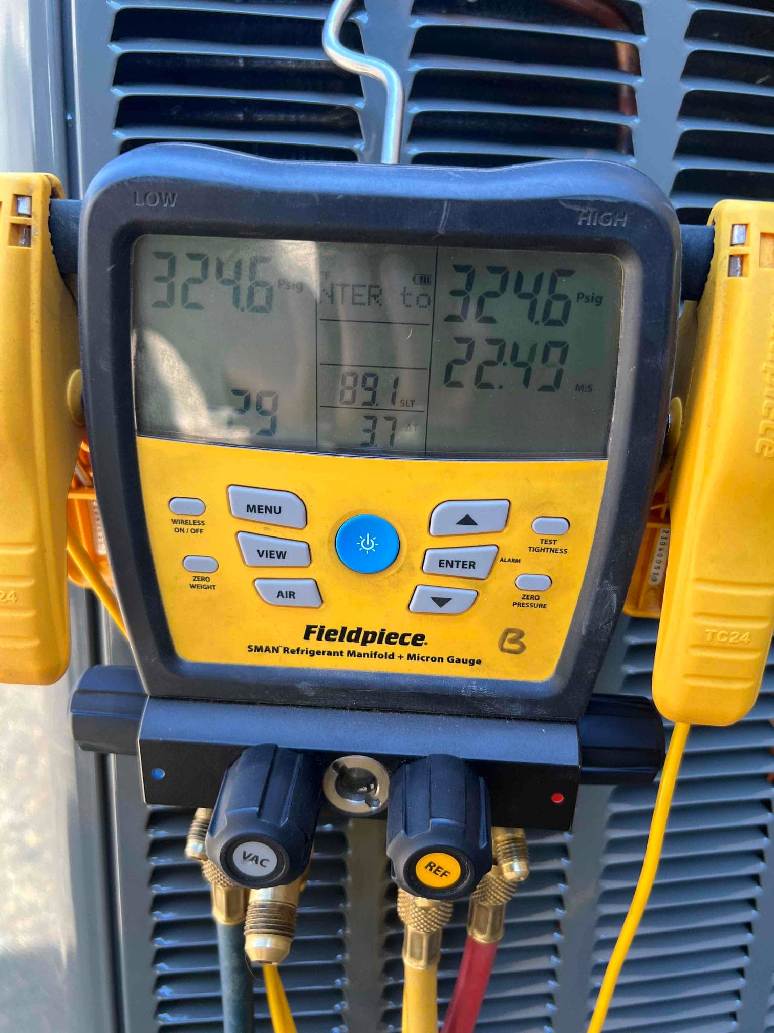 Digital manifold shows equal pressures of 324.6 PSI on both sides during a nitrogen pressure test of the new system.