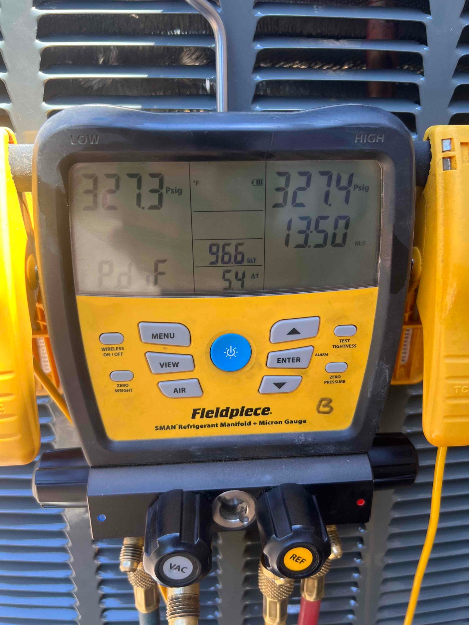 Digital manifold shows equal pressures around 327 PSI on both sides during a nitrogen pressure test of the new system.