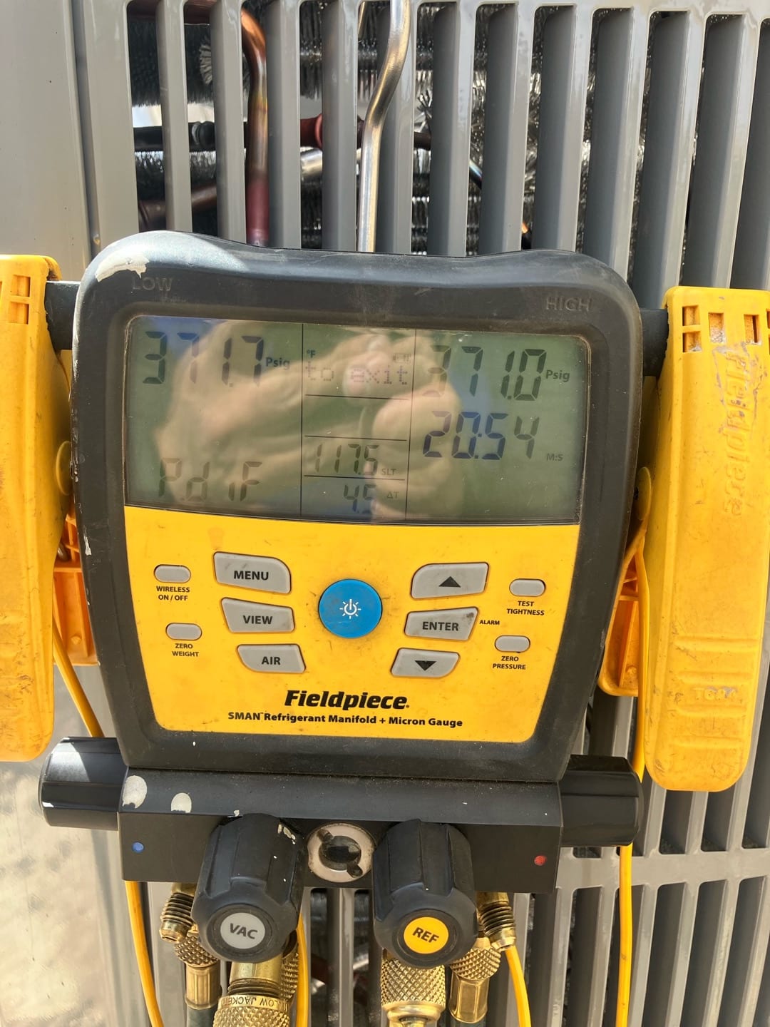 Digital manifold shows equal pressures around 371 PSI on both sides during a nitrogen pressure test of the new system.