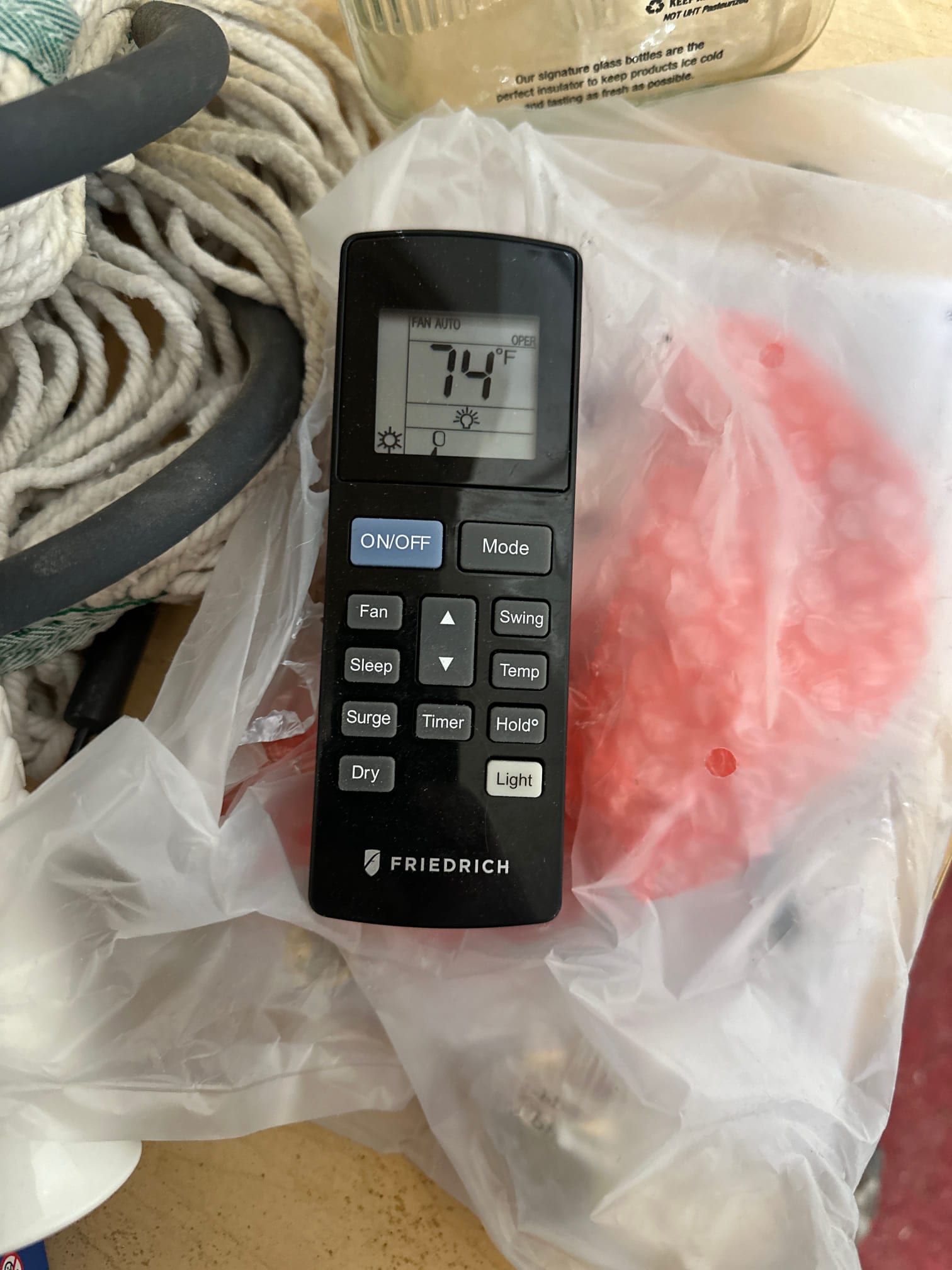 Mini-split remote displays 74°F setpoint with fan on auto during startup checks.