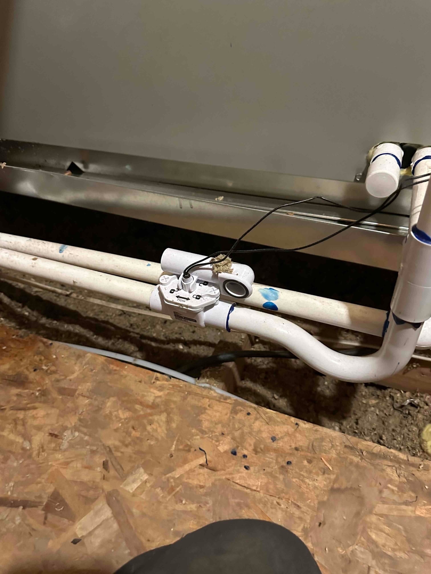 Condensate drain assembly at the air handler with an inline float safety switch wired to shut off on overflow.