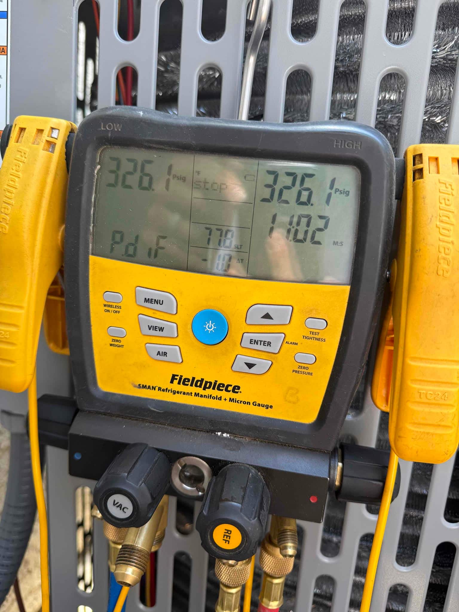 Digital manifold shows equal pressures of 326 PSI on both sides, documenting a nitrogen pressure test of the new system.