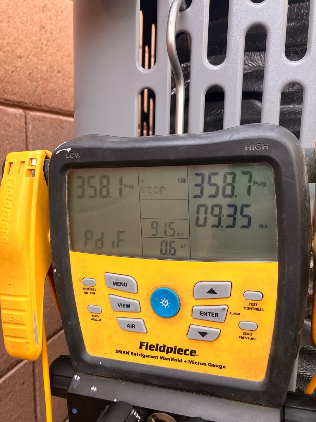 Digital manifold shows equal pressures near 358 PSI on both sides during a nitrogen pressure test of the new system.