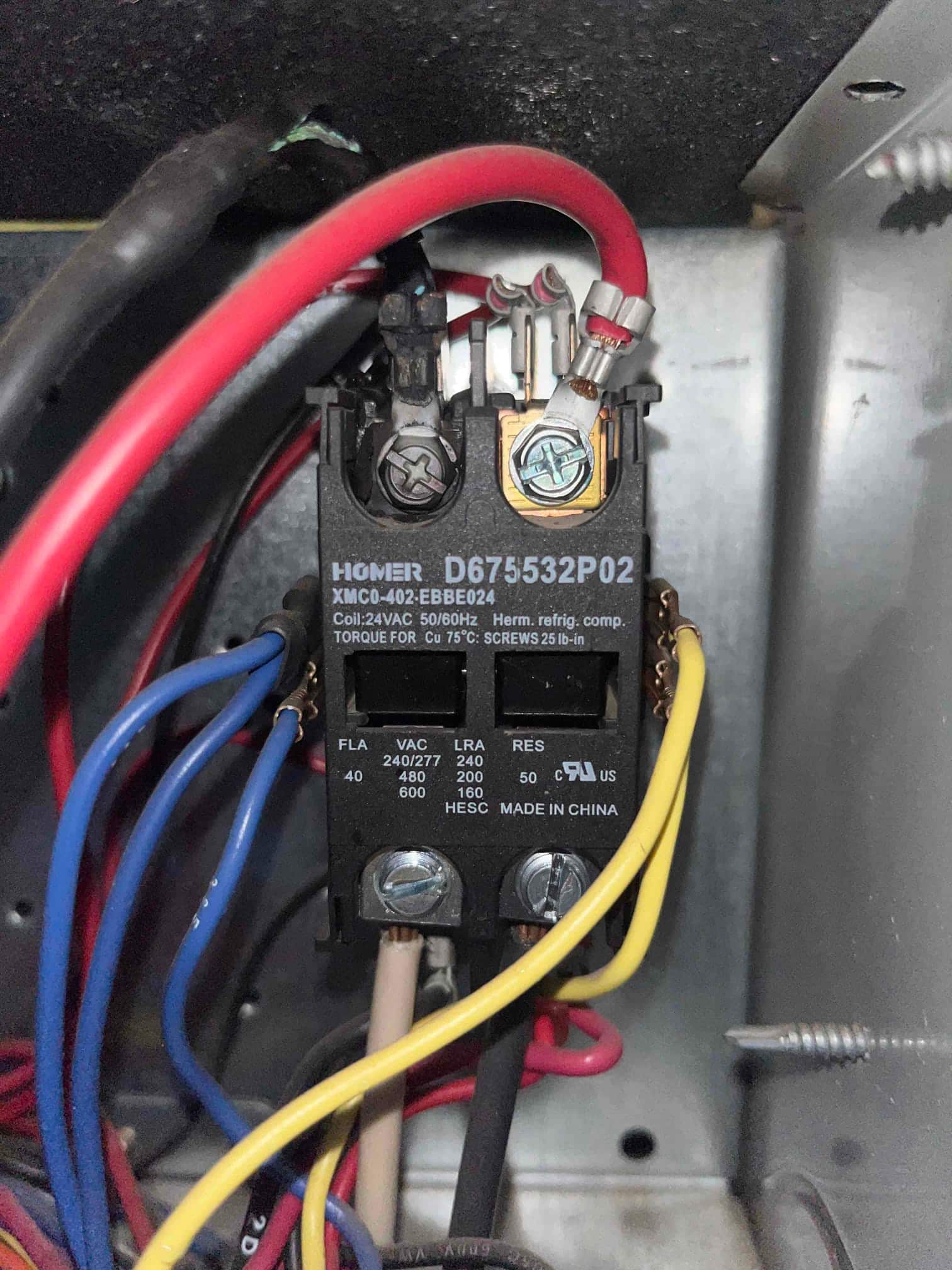 New two-pole contactor installed in condenser control panel, showing clean terminals and secured line and load wiring connections.