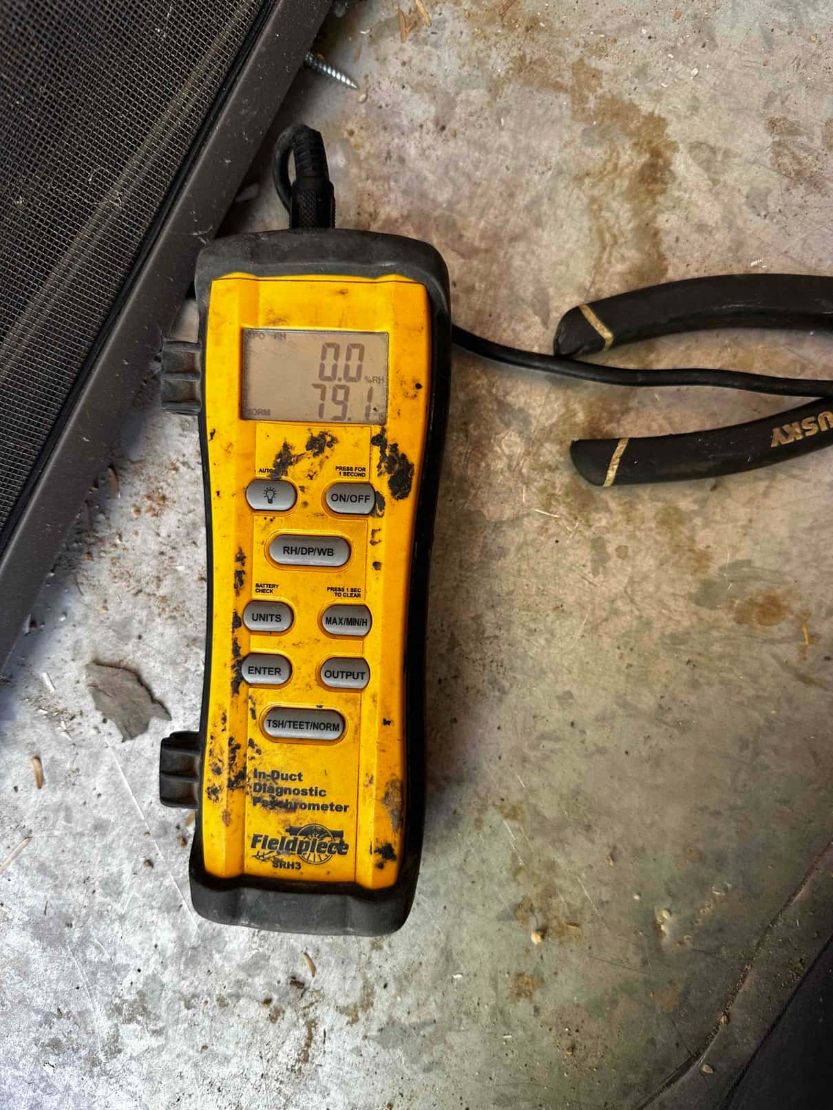 Digital hygrometer on the job site displays 79.1 on the temperature screen during return air check.