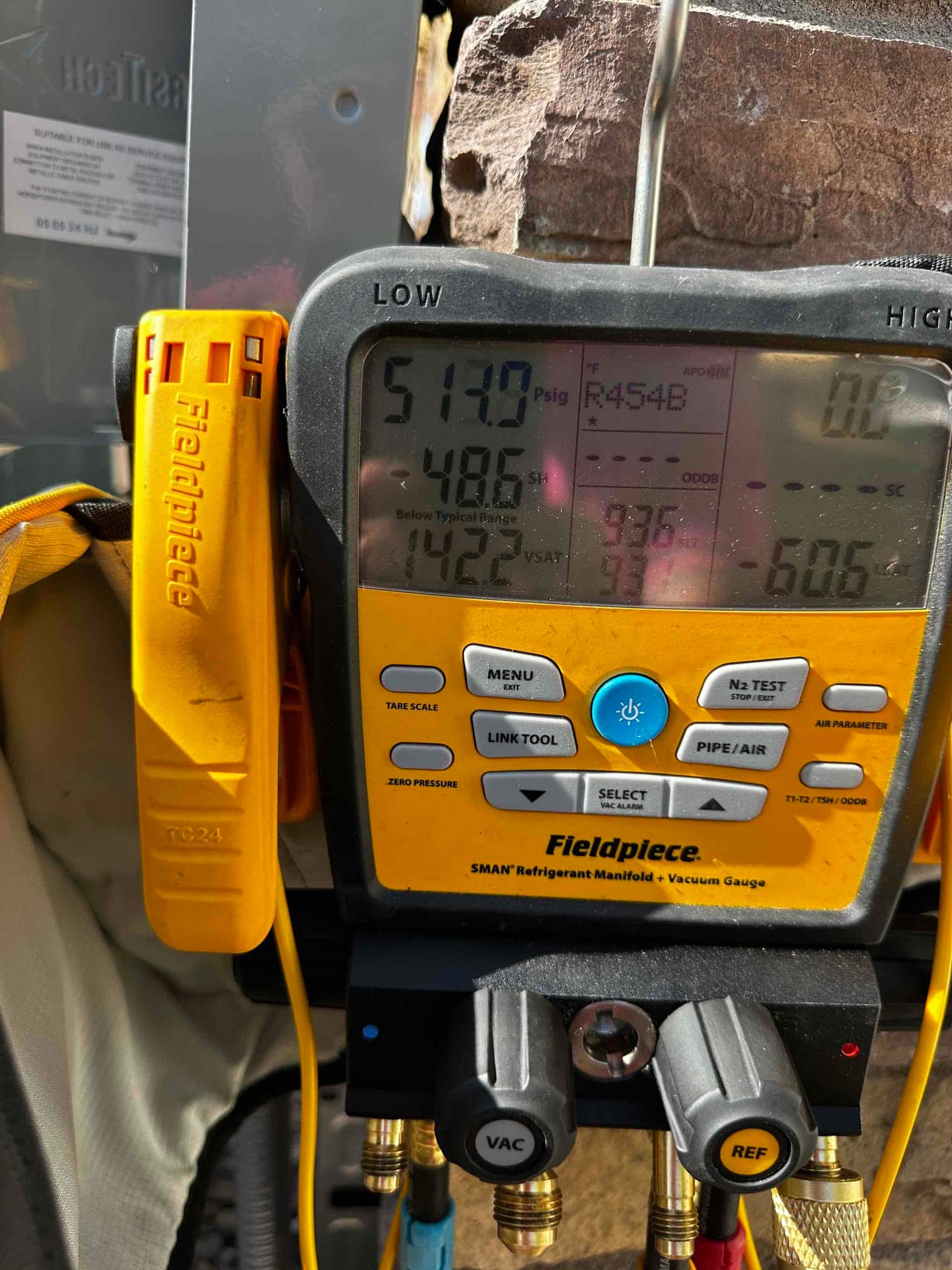 Digital manifold gauges hold equal pressure near 513 PSI on both sides during the nitrogen pressure test of the new system.