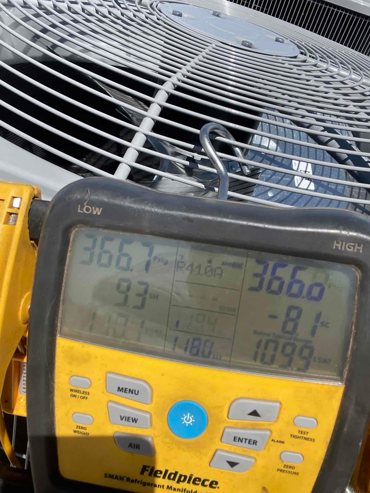 Digital manifold shows equal pressures around 366 PSI on both sides during the nitrogen pressure test at the outdoor unit.