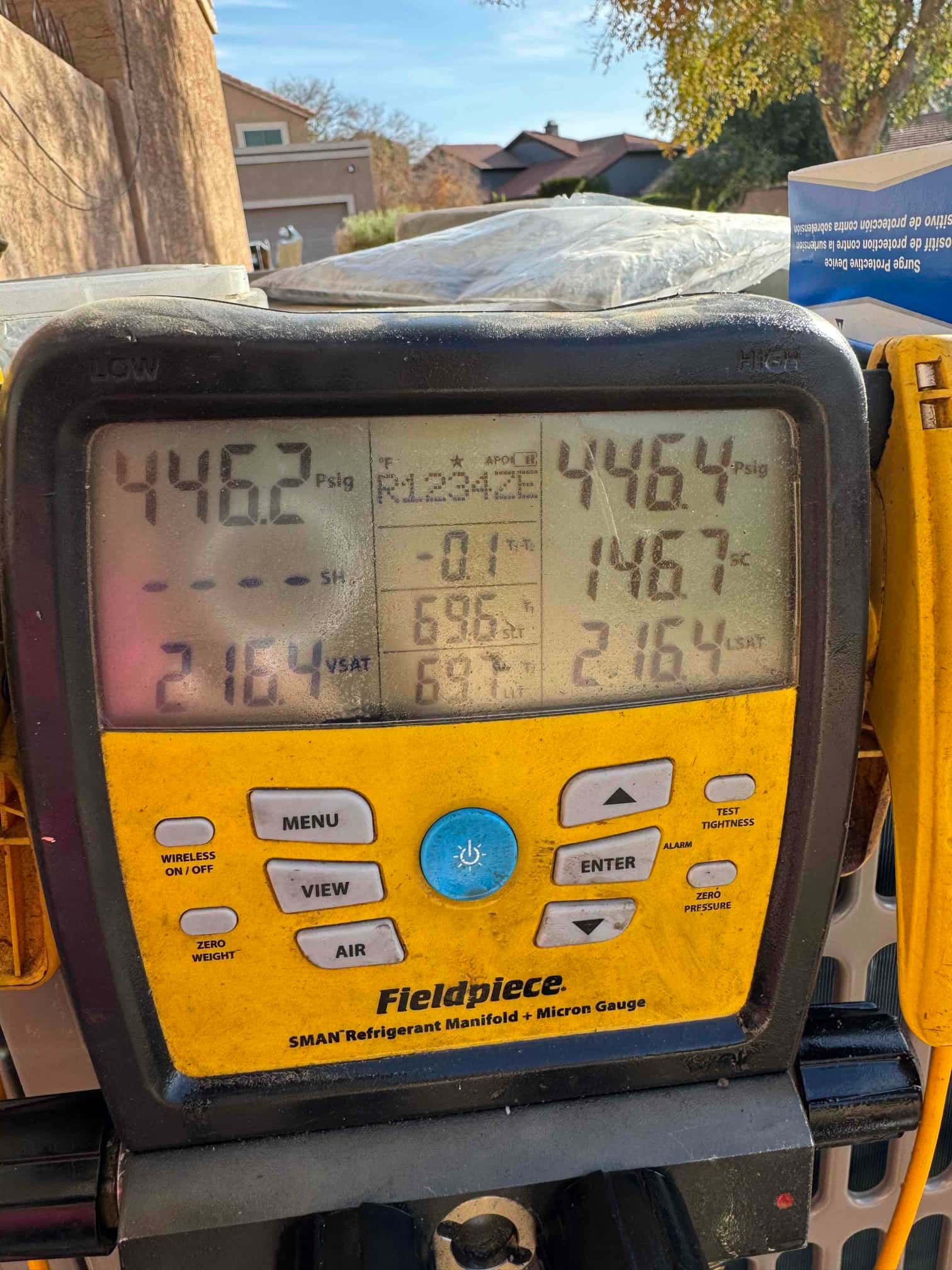 Digital manifold shows equal pressures around 446 PSI on both sides during a nitrogen pressure test of the line set.