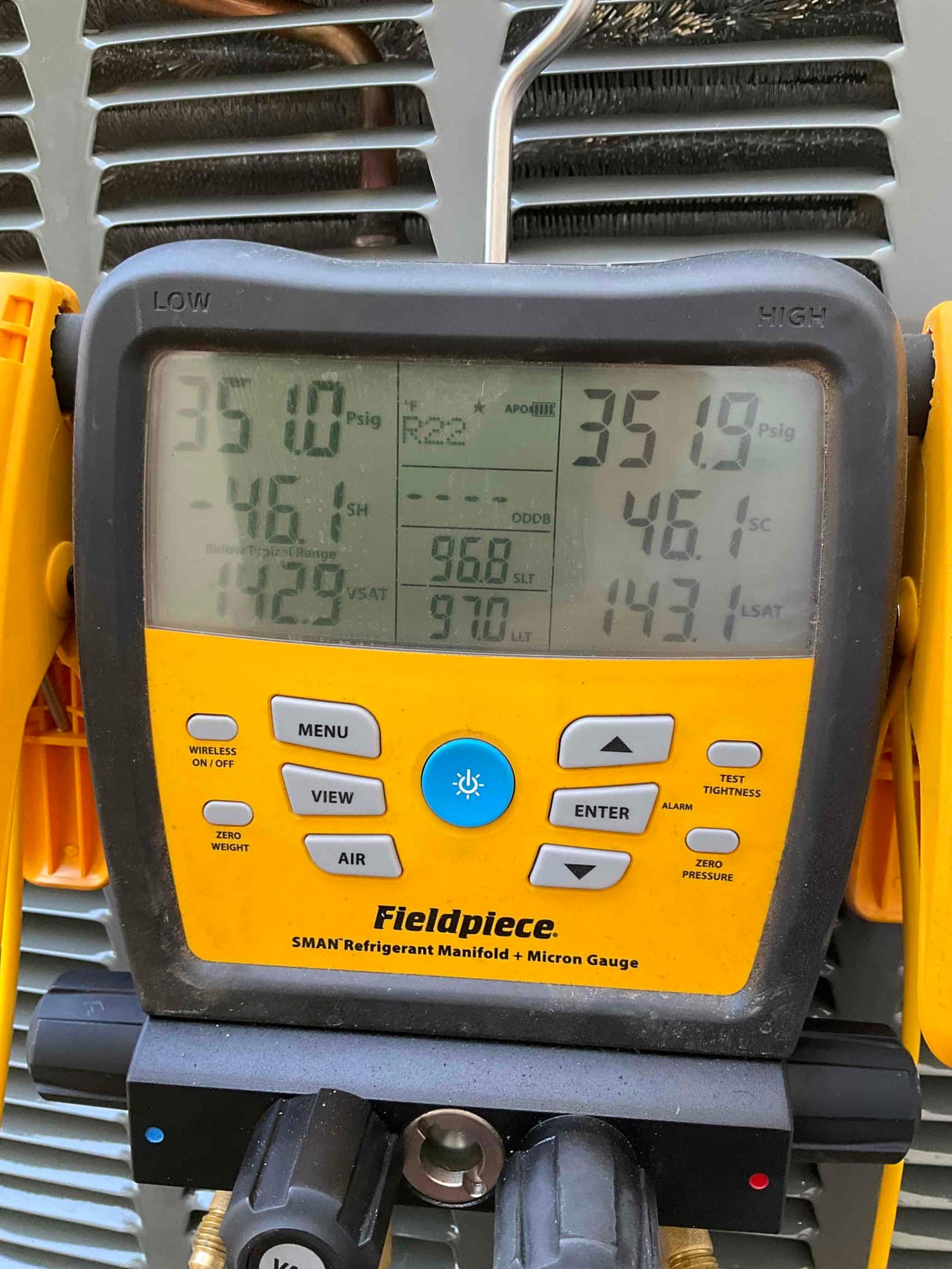 Digital manifold shows equal pressures near 351 PSI on both sides, documenting a nitrogen pressure test on the new system.