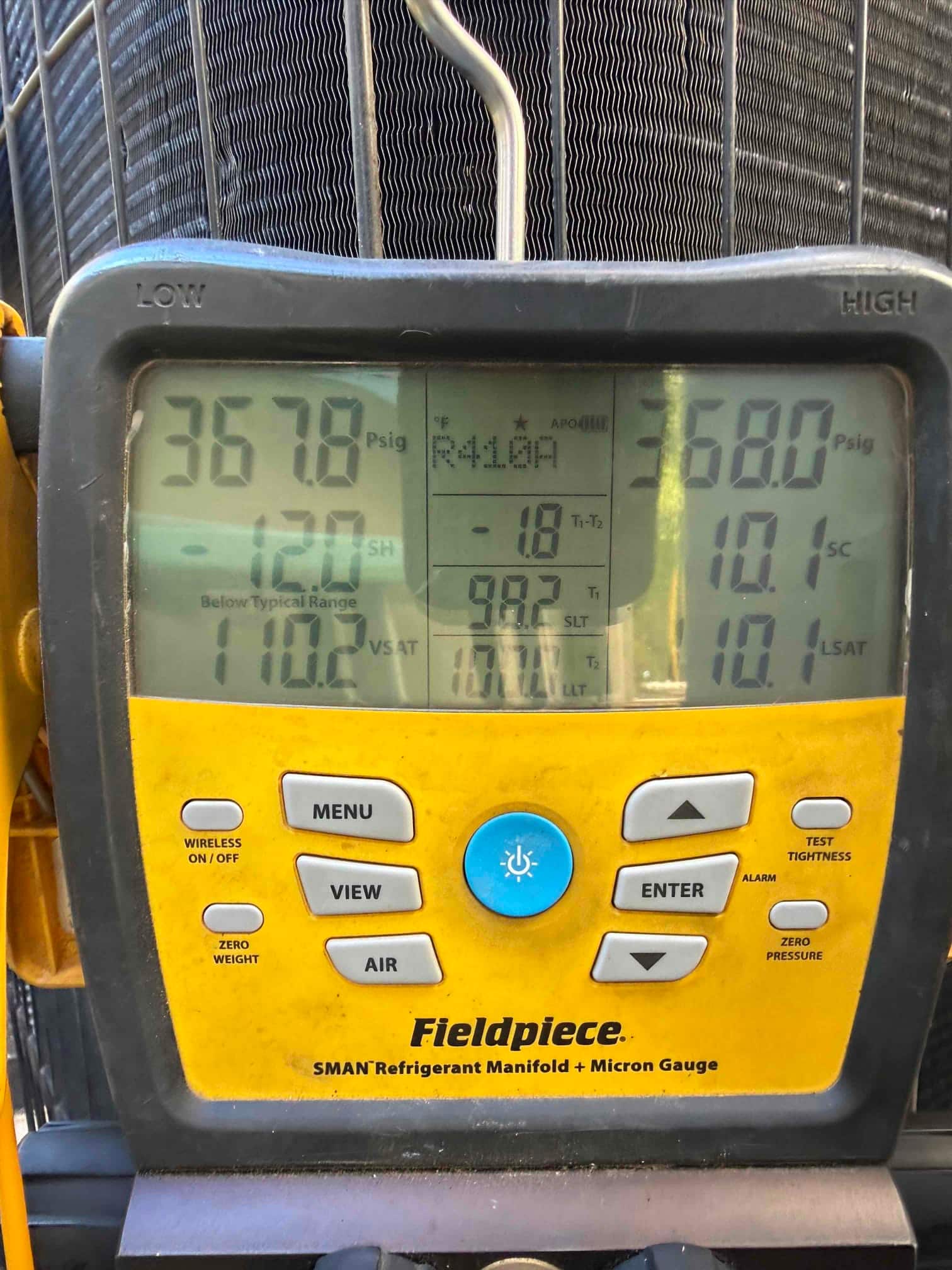 Digital manifold shows both high and low sides holding around 368 PSI, documenting the nitrogen pressure test on the new system.
