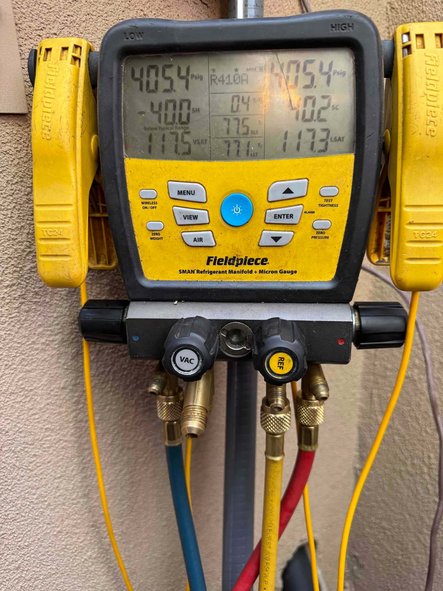 Digital manifold shows both high and low sides holding 405 PSI during a nitrogen pressure test on the newly installed system.