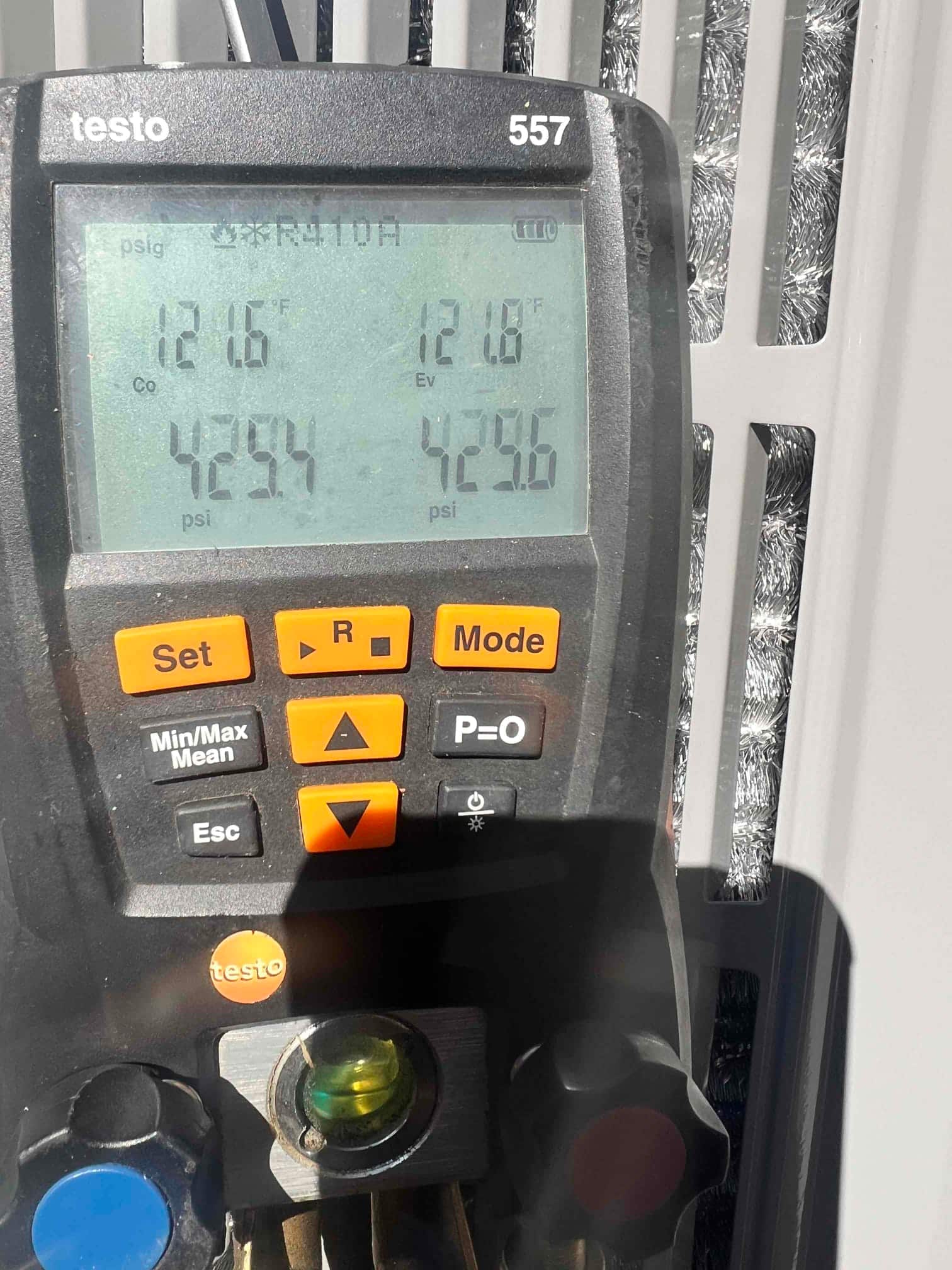 Digital manifold shows both high and low sides holding around 429 PSI during a nitrogen pressure test on the new system.
