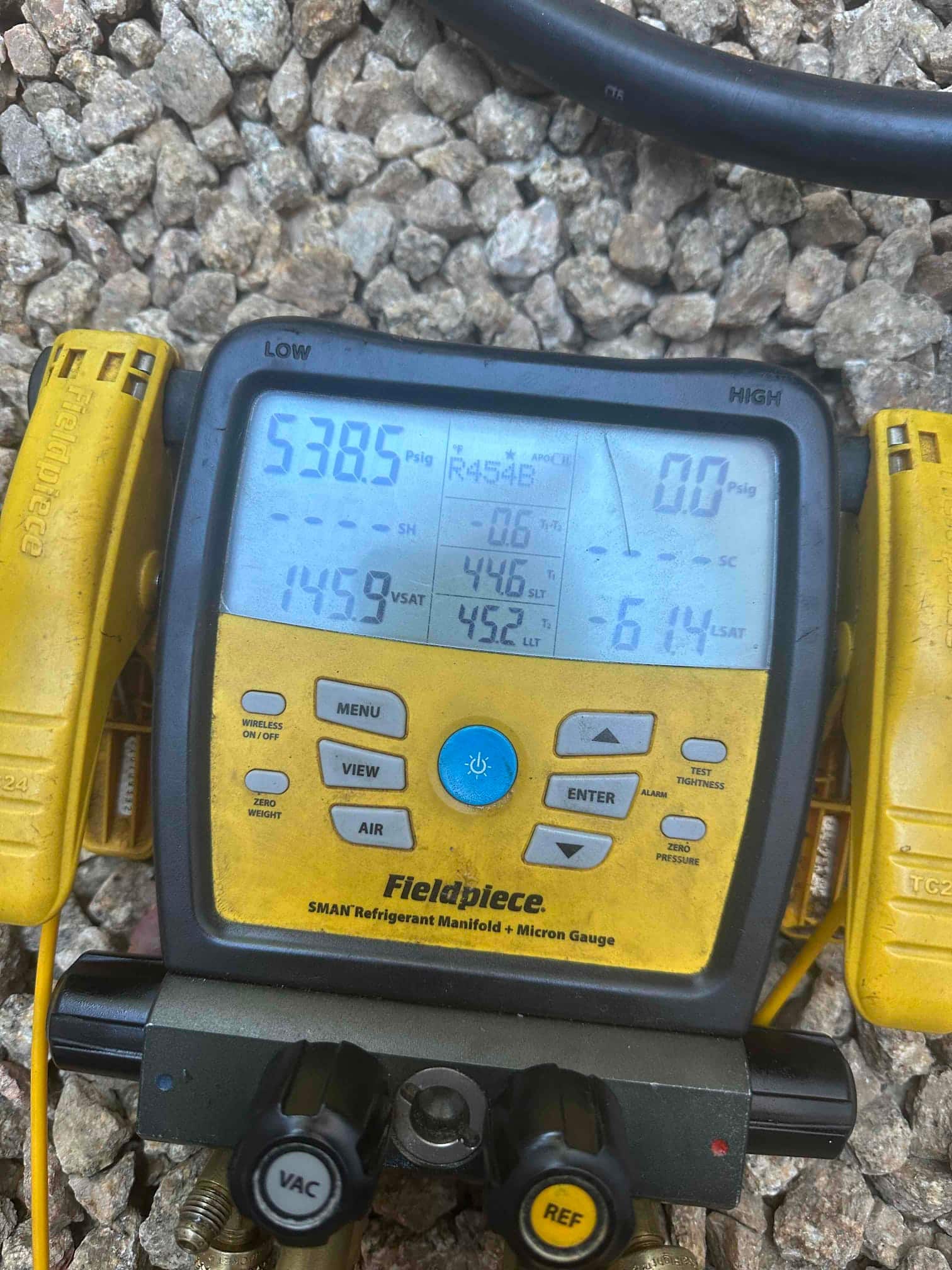 Digital manifold shows both sides equalized during a nitrogen pressure test of the new mini-split line set.