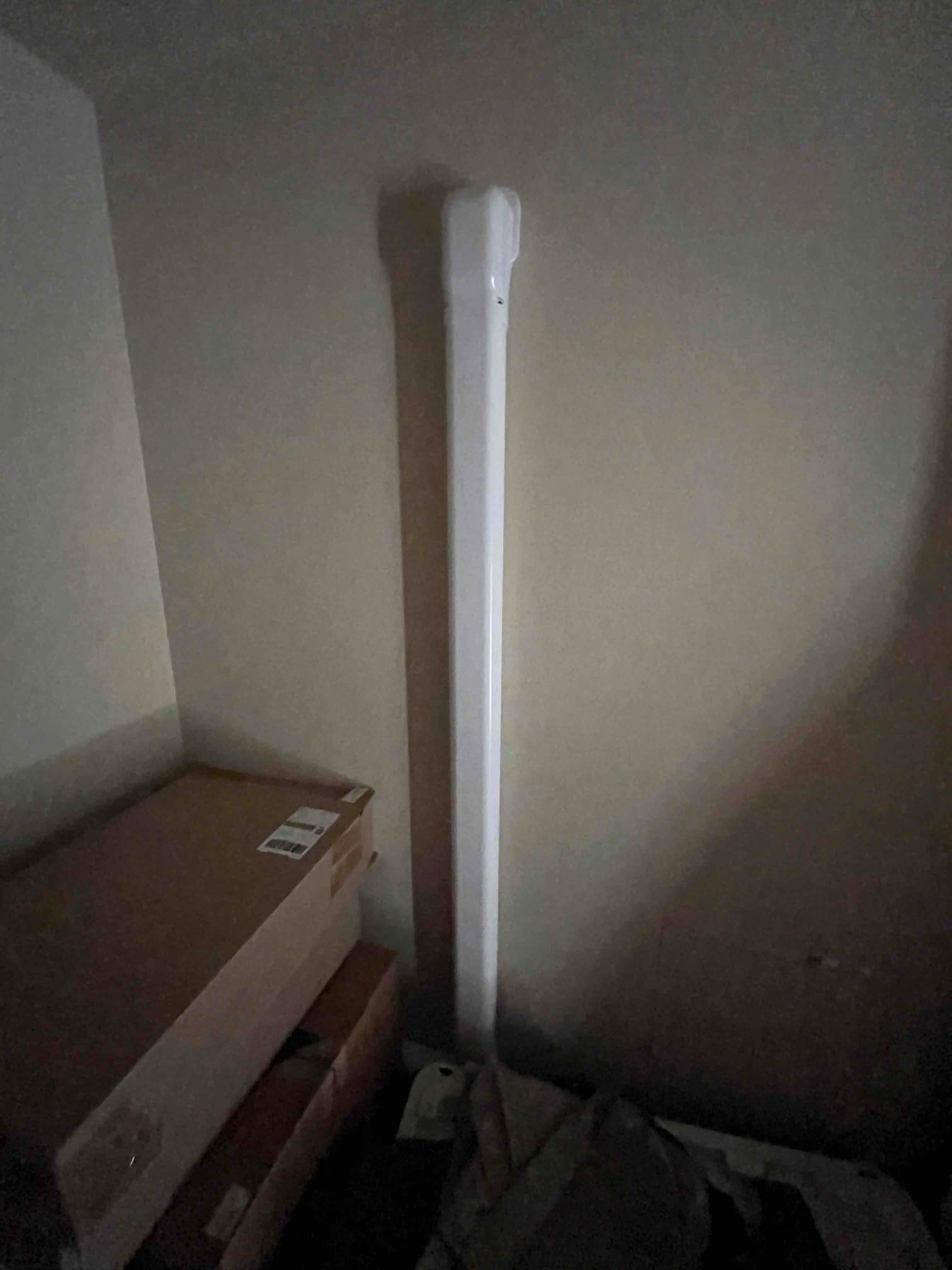 Line-set cover installed vertically in the corner, protecting refrigerant and drain lines for the new mini-split system.