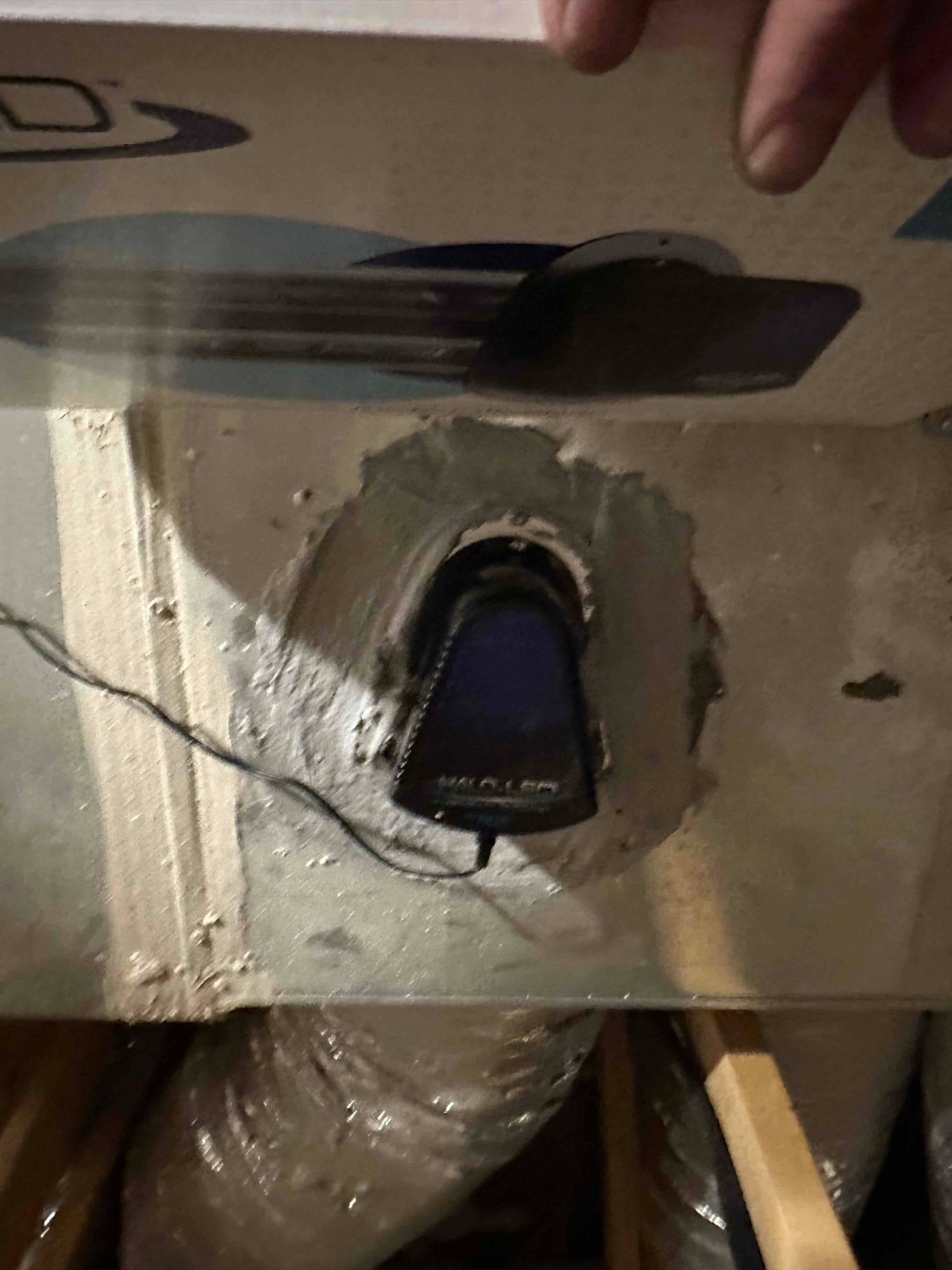 UV air purifier lamp mounted on the supply plenum, with wiring routed and mastic-sealed penetration around the housing.