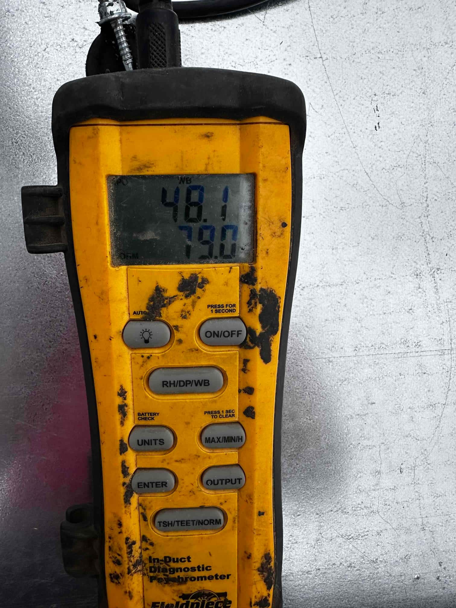 Digital hygrometer-thermometer shows 79.0 degrees Fahrenheit and 48.1 on the wet-bulb scale during air-side measurements.