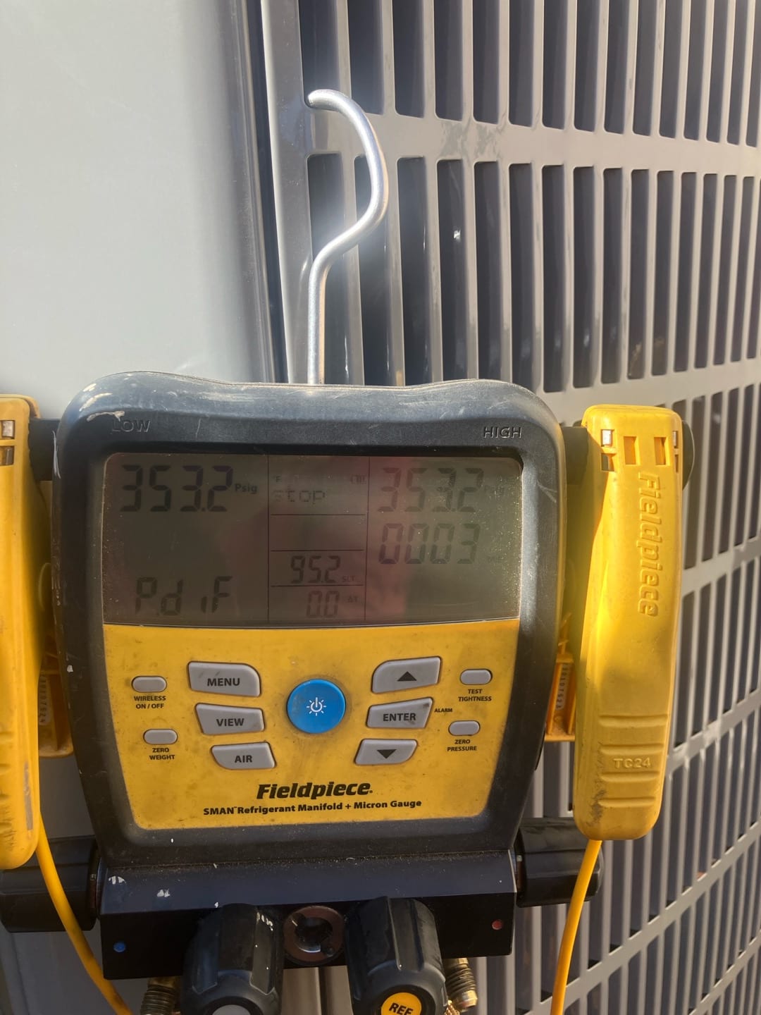 Digital manifold shows equal pressure at 353 PSI on both ports during a nitrogen pressure test of the new system.