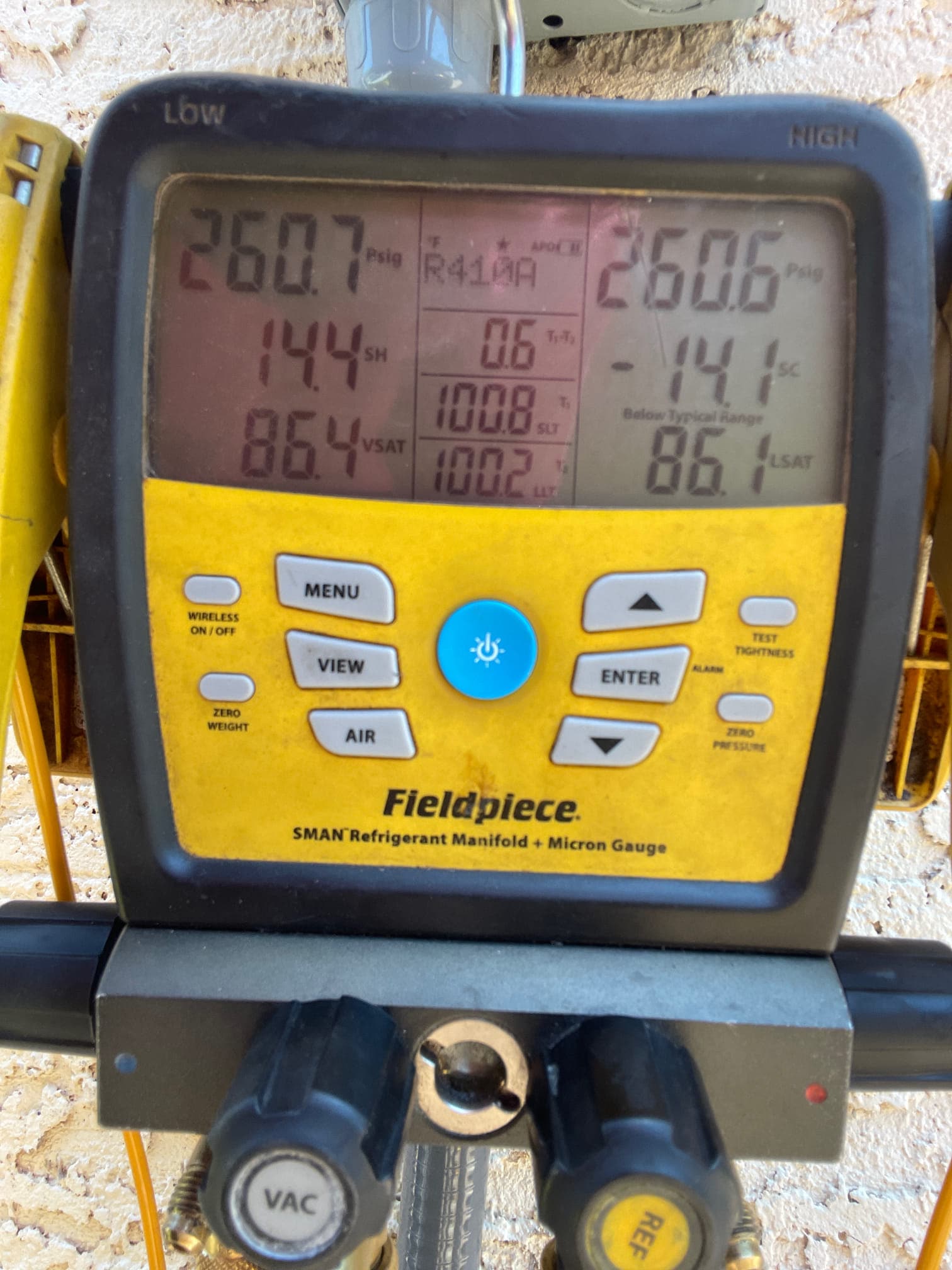Digital manifold shows both high and low sides at equal pressure during a nitrogen pressure test of the new system.