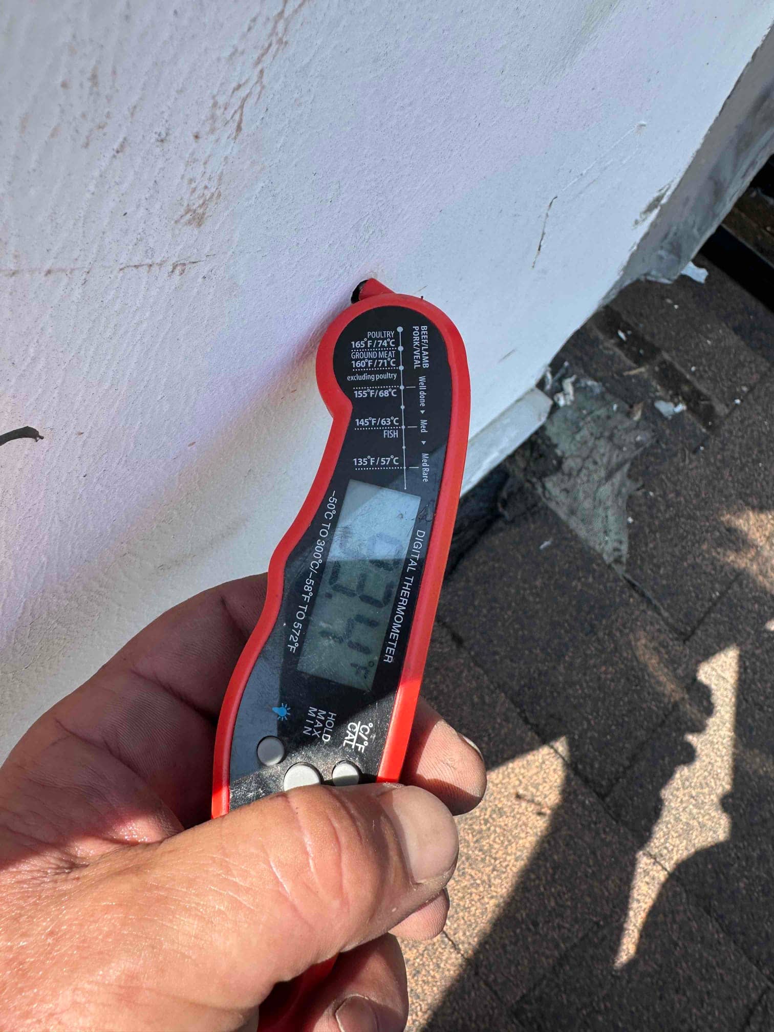 Digital thermometer shows 72.1°F while measuring air temperature during HVAC commissioning.