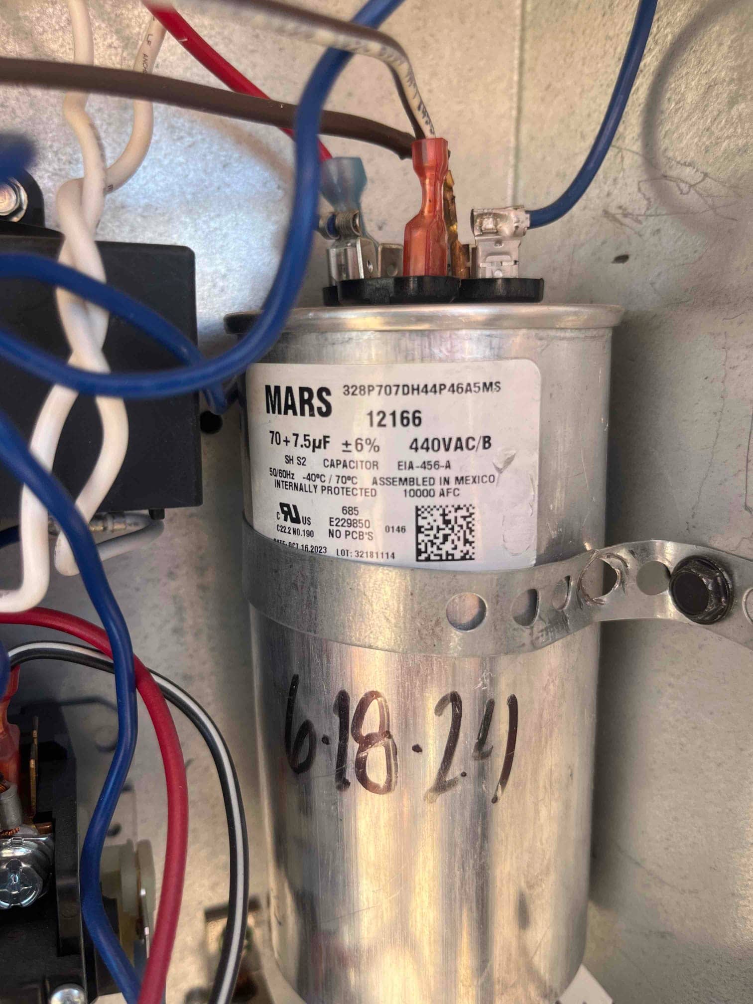 Turbo 200X-style run capacitor installed with connected wiring, labeled 70–7.5 μF ±6% and 440VAC/B, dated 6-18-24 on the housing.