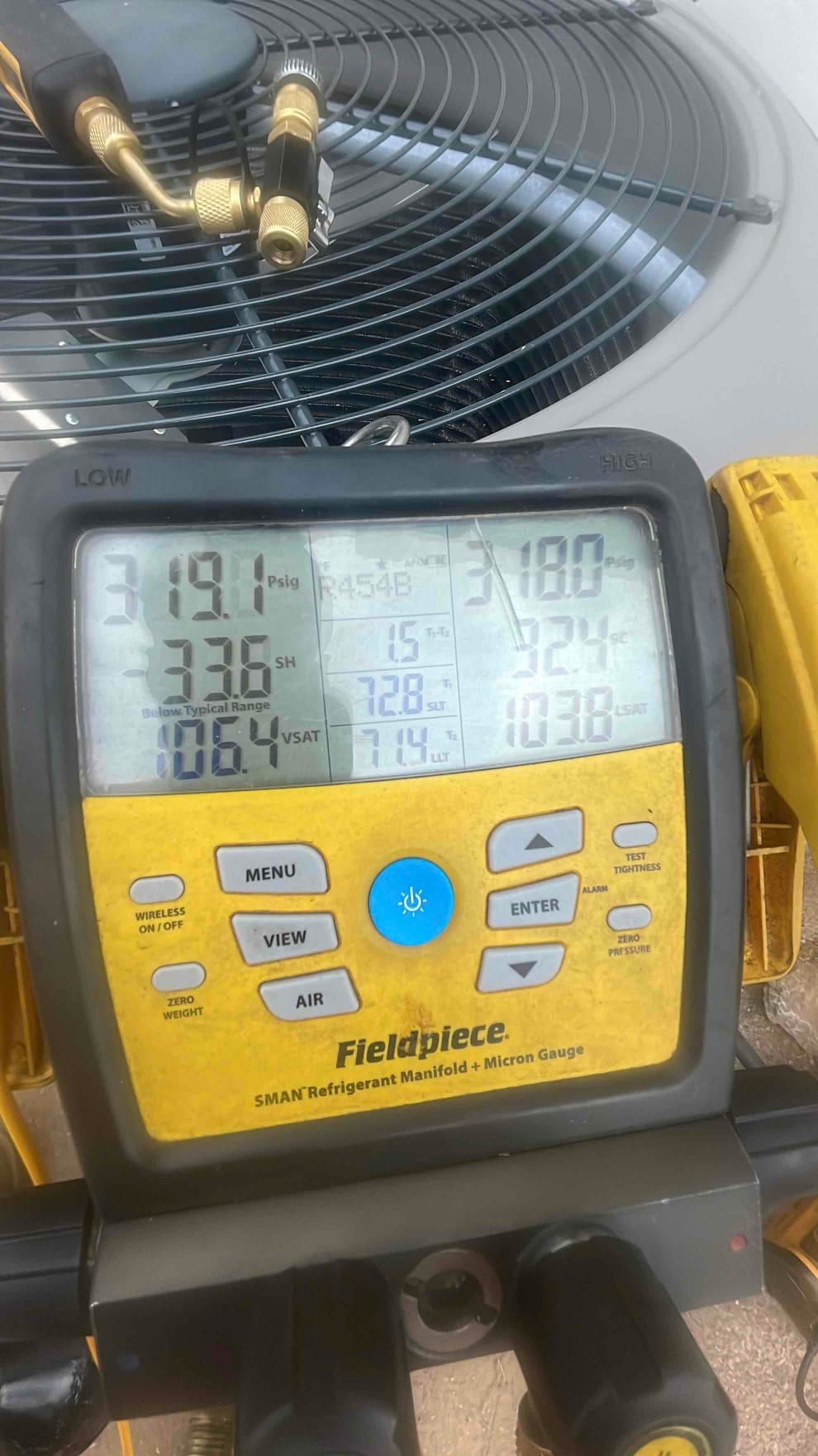 Digital manifold connected at the condenser shows operating pressures and temperatures during system startup with R‑454B refrigerant.