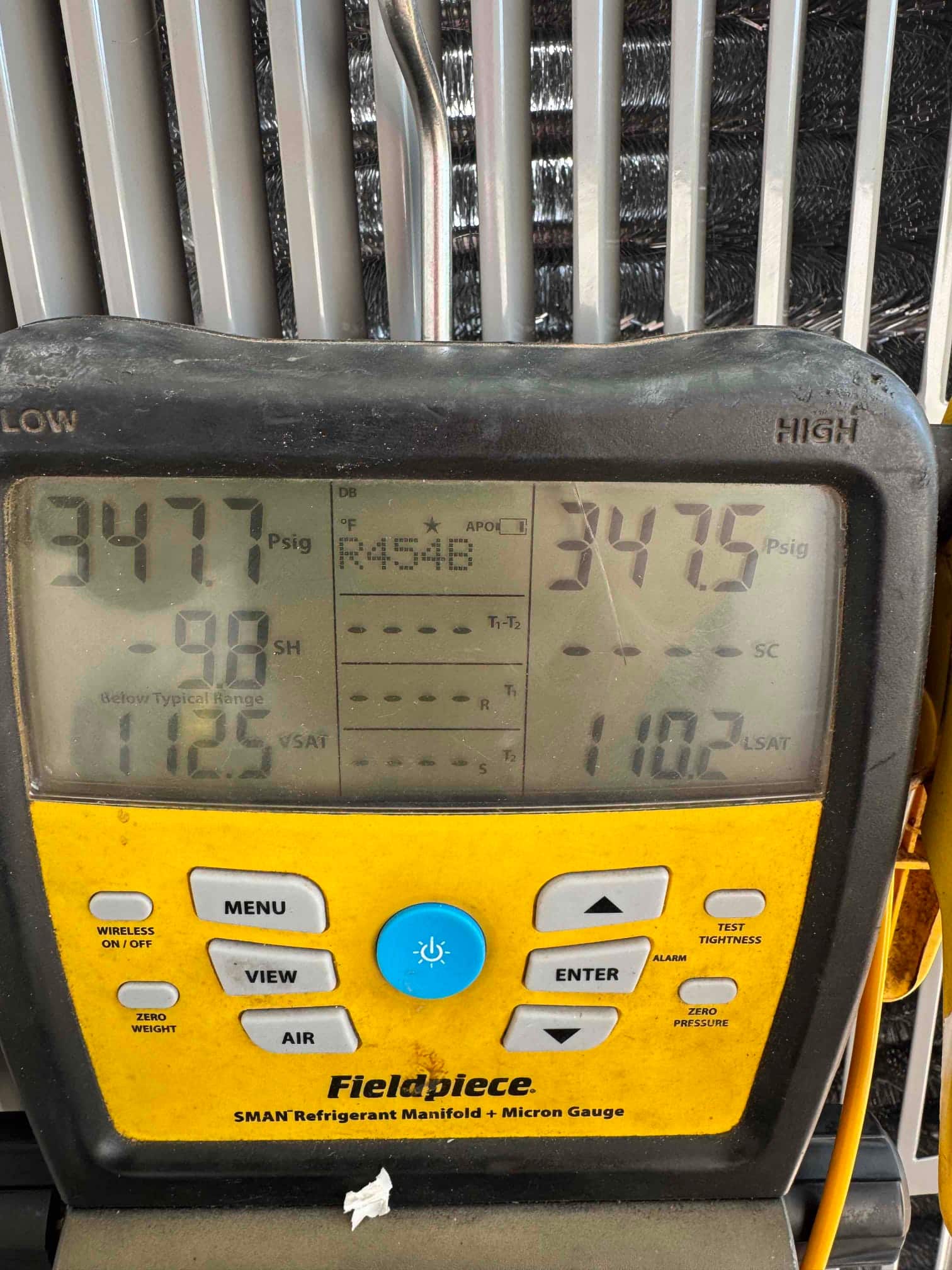 Digital manifold shows equal pressures near 347 PSI on both high and low sides during a nitrogen pressure test.