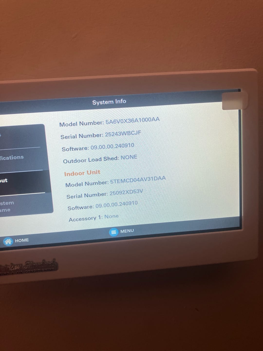 Thermostat display shows system information screen after installation, confirming connected outdoor and indoor units with software versions.