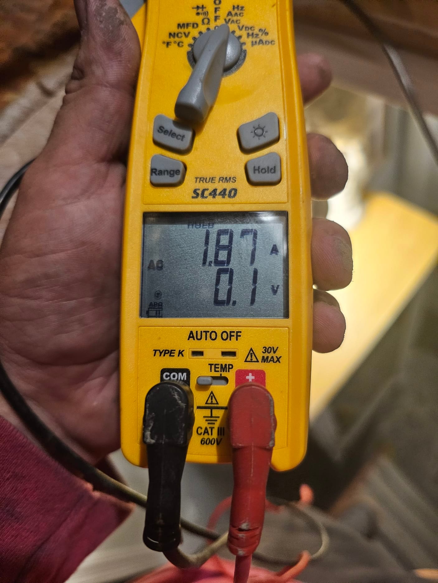 Diagnostic instrument display shows 1.87 A.