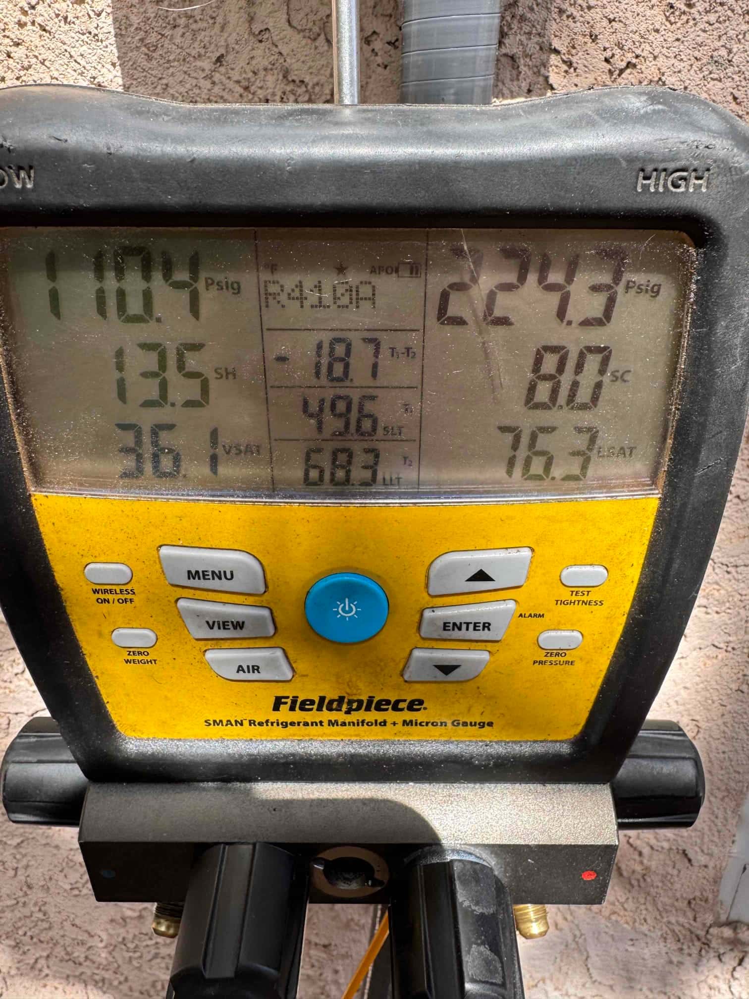 Digital manifold shows operating pressures with R-454B selected: low side 110.4 PSI and high side 224.3 PSI during system run.