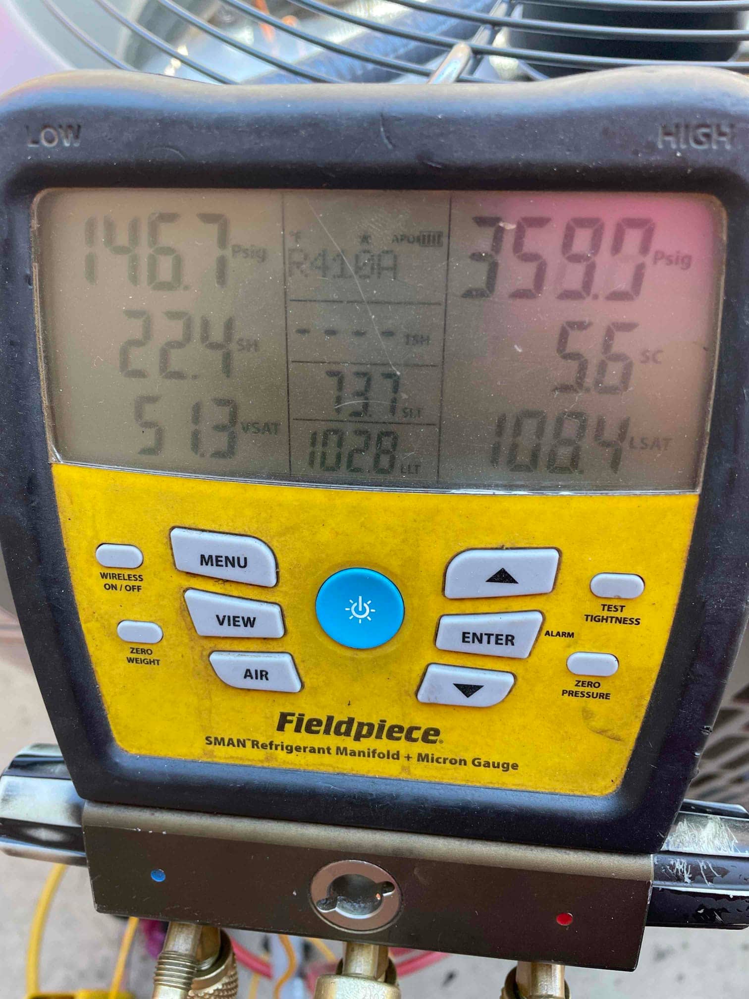 Digital manifold shows system operating pressures with low side at 147 PSI and high side at 359 PSI on R-410A.