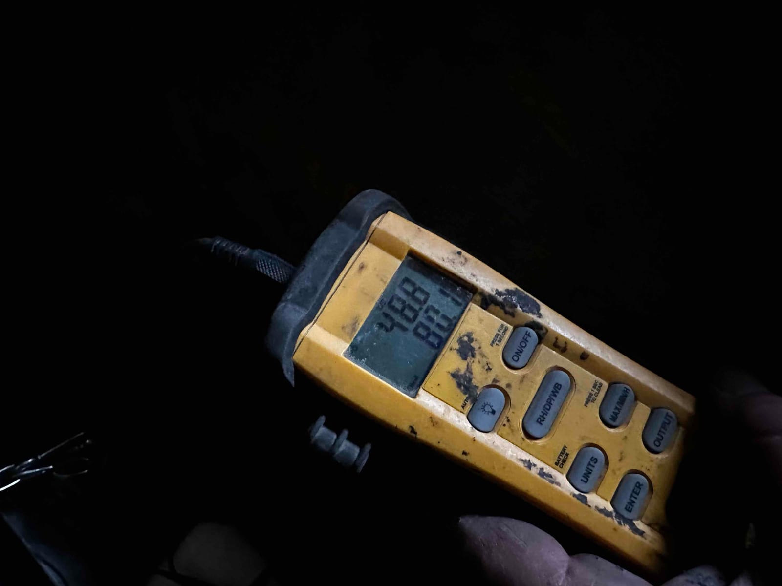 Digital thermometer displays 78.8 and 80.1 degrees Fahrenheit while measuring air temperature during commissioning.