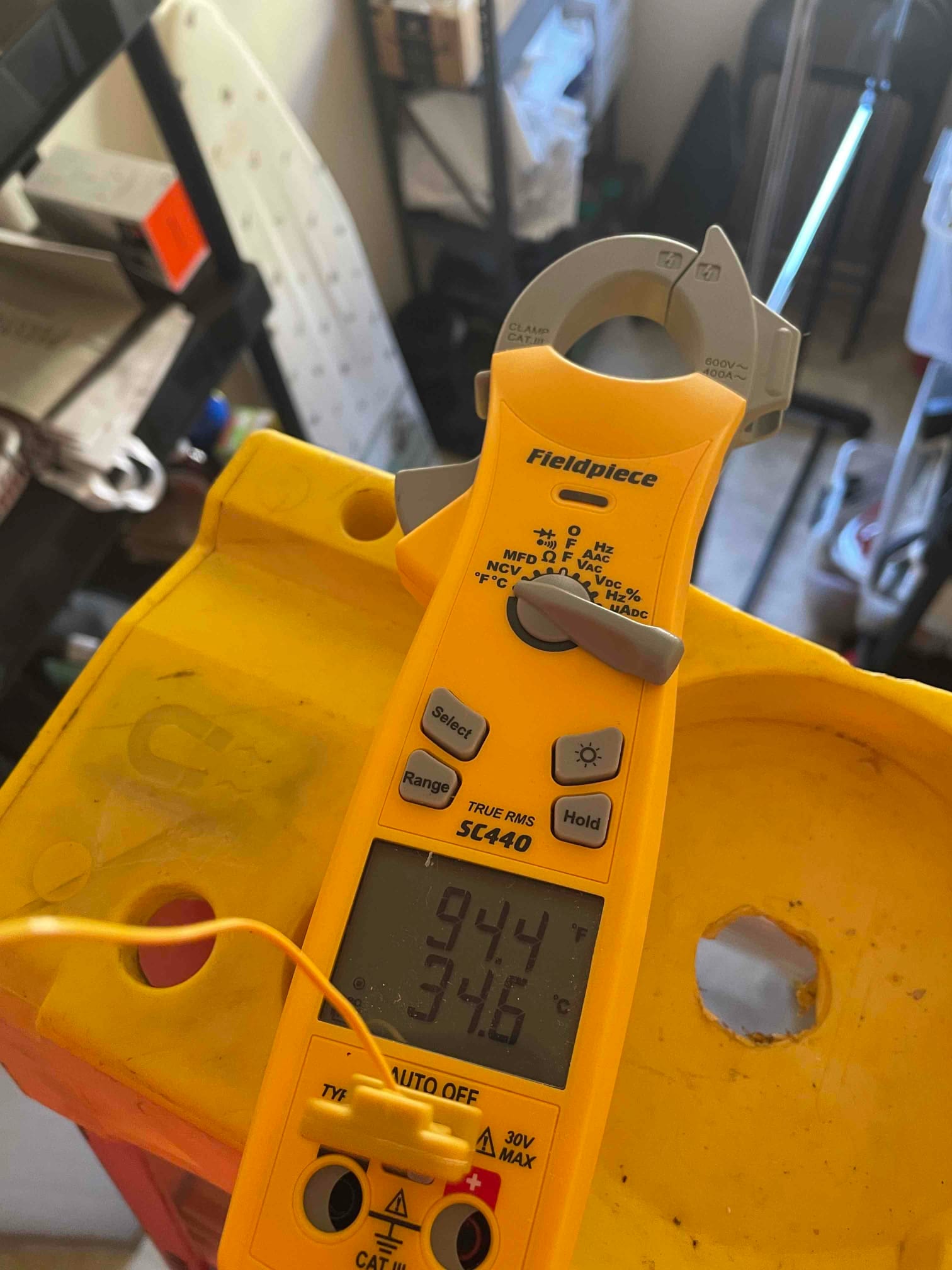 HVAC diagnostic instrument photographed during the service visit.