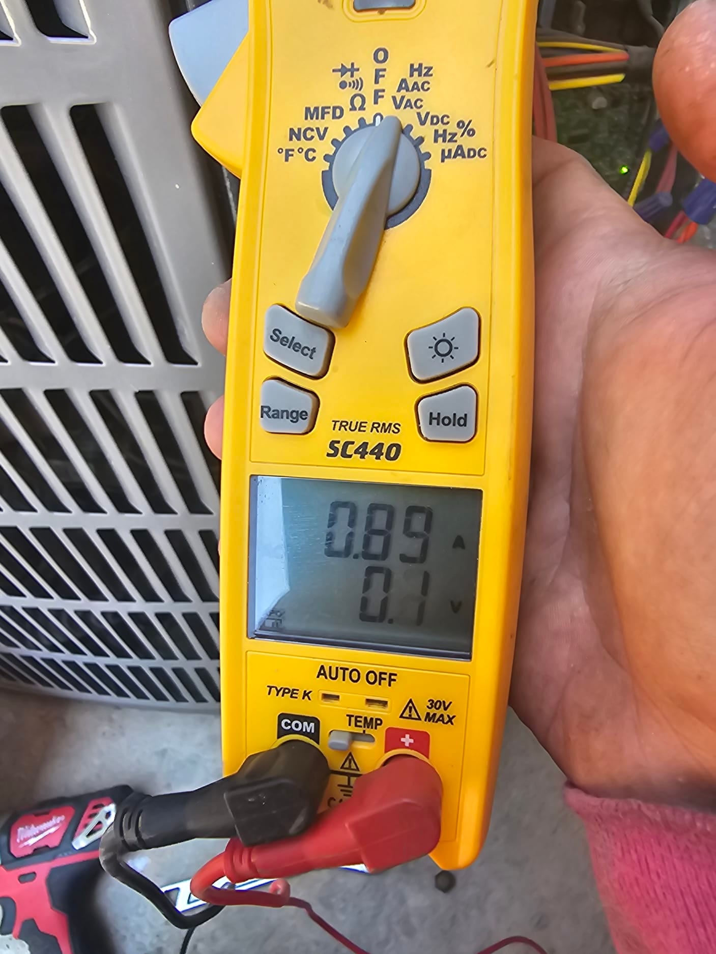 HVAC diagnostic instrument photographed during the service visit.