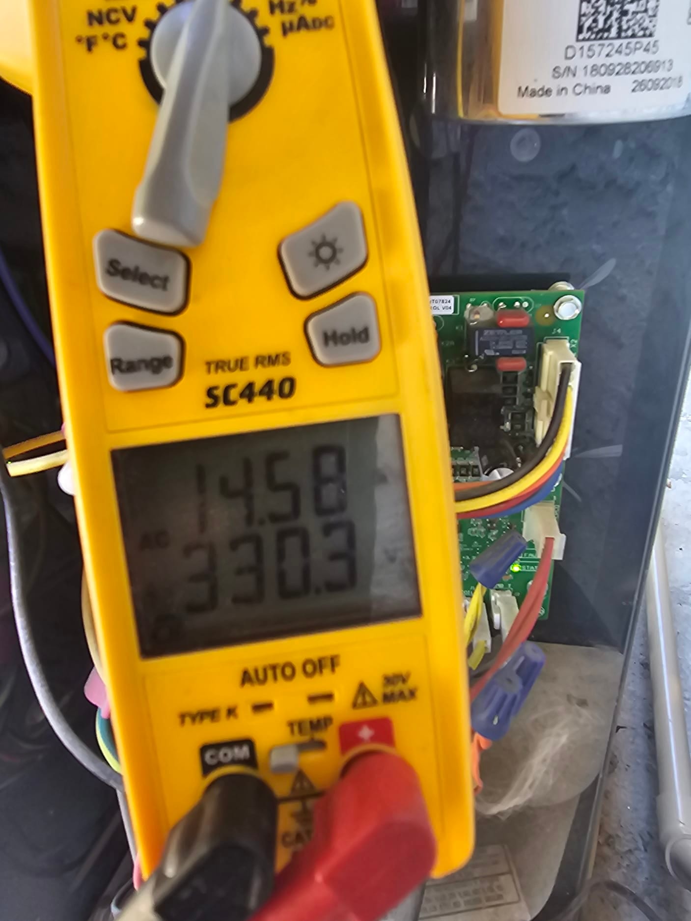 HVAC diagnostic instrument photographed during the service visit.