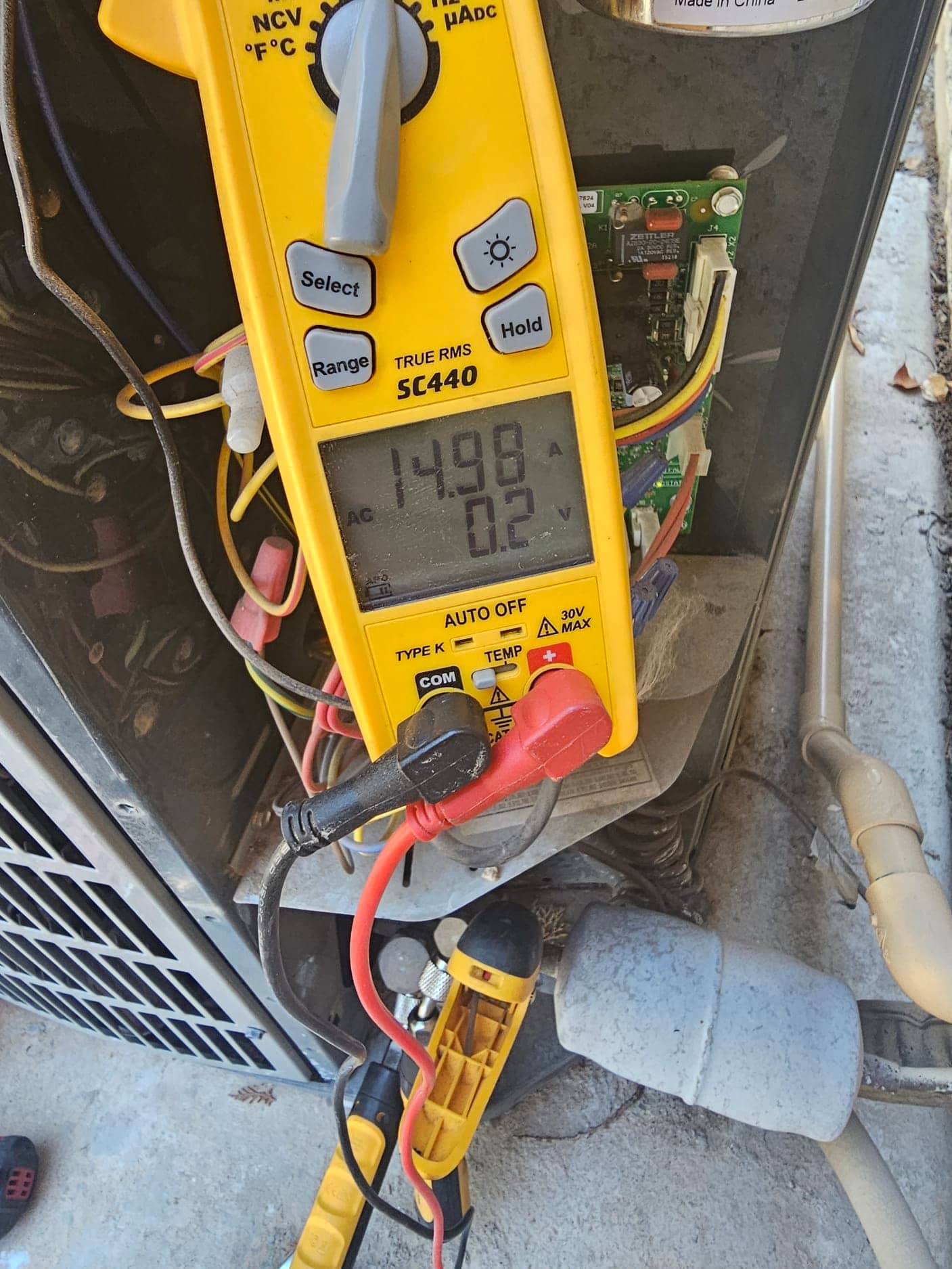 HVAC diagnostic instrument photographed during the service visit.
