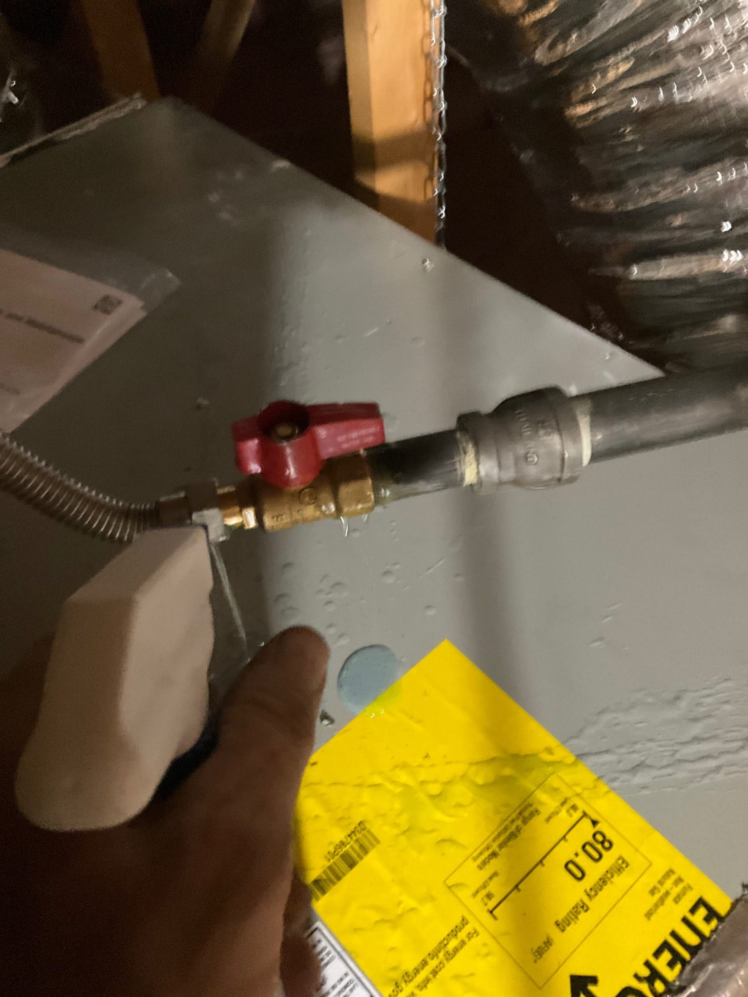 Leak detection solution is applied to a gas shutoff valve connection on a newly installed HVAC air handler.