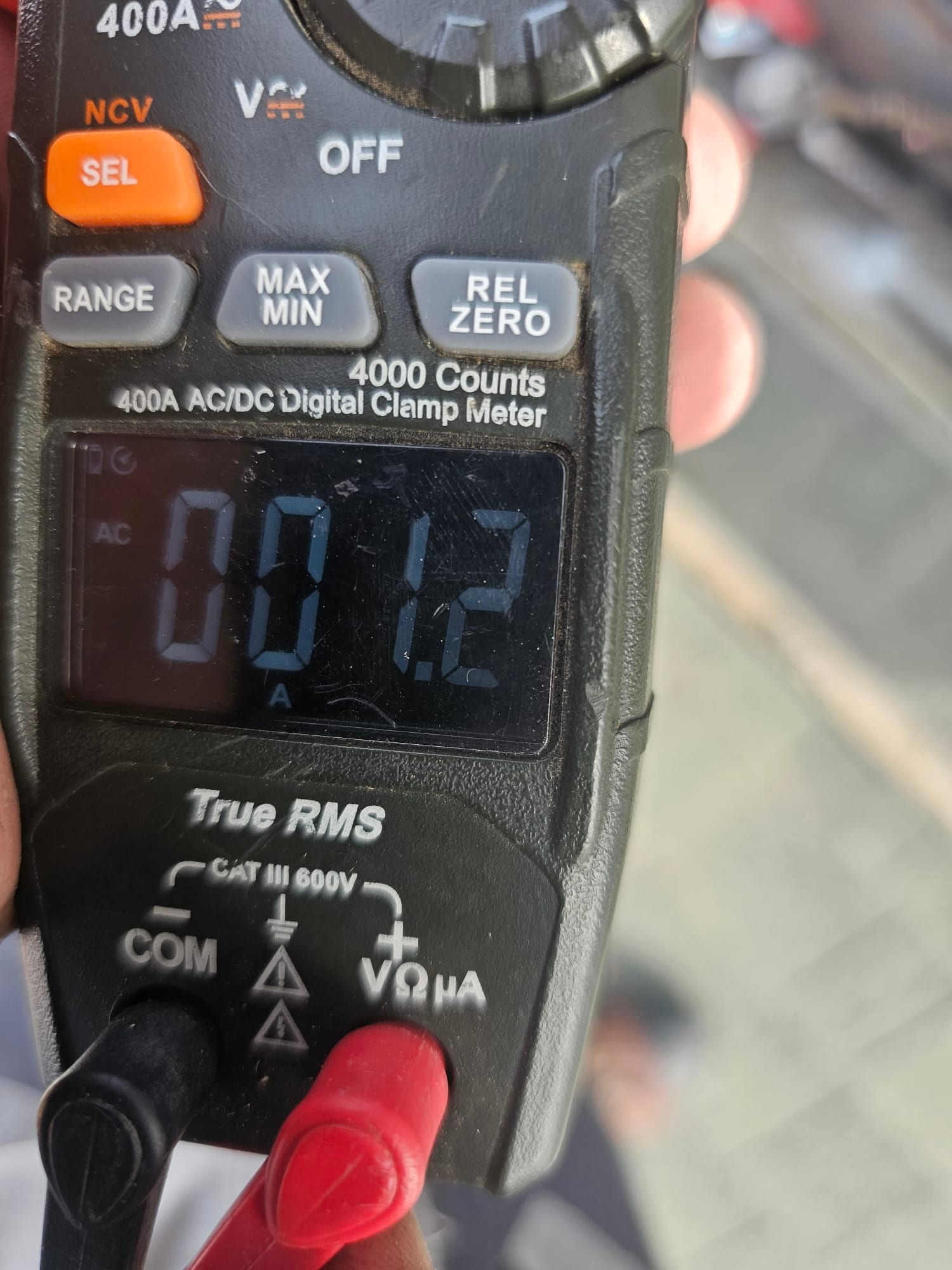 Diagnostic instrument display shows 1.2 A.